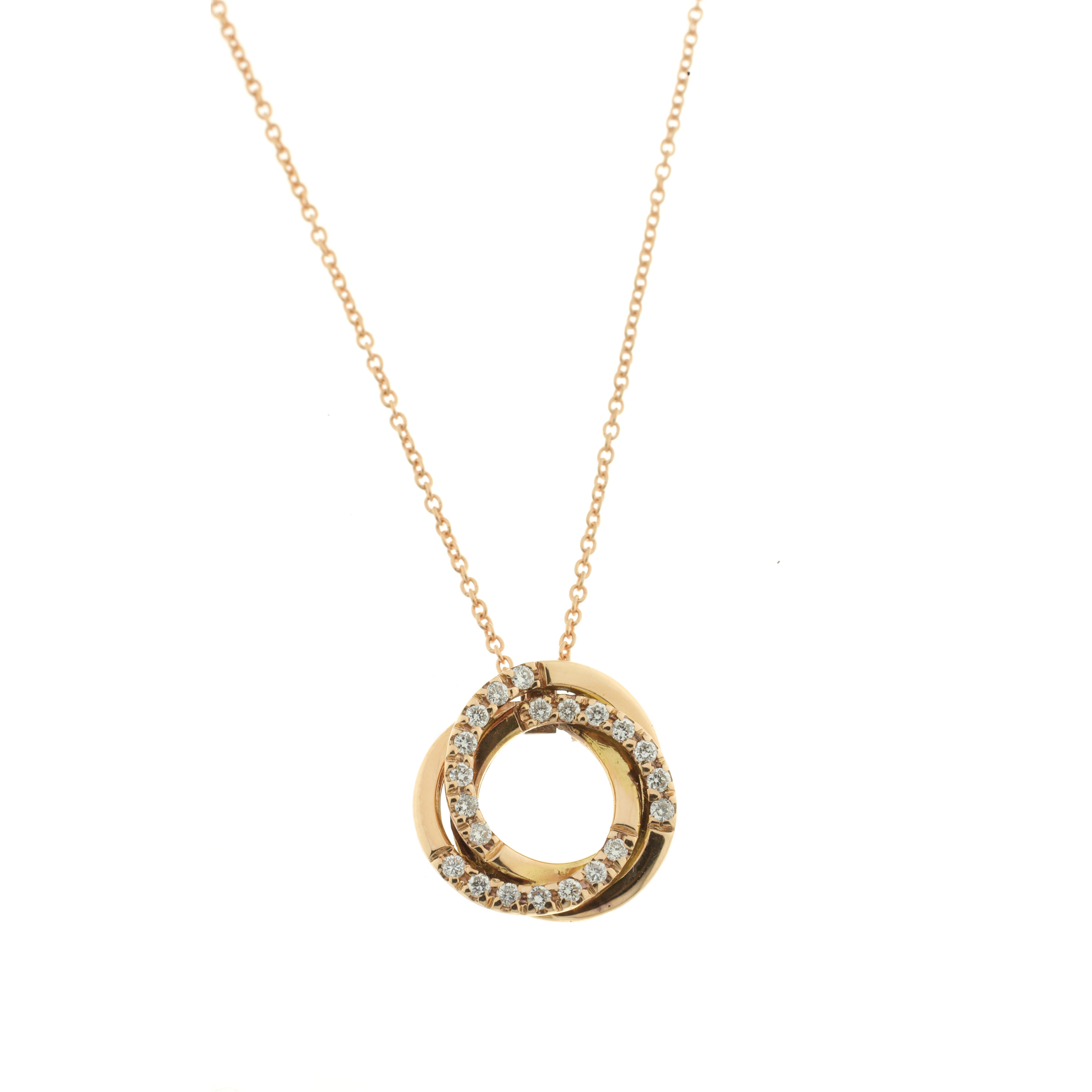 This gorgeous coiled 18-karat rose gold pendant provides the perfect backdrop for 21 carefully selected white diamonds and hangs from a rose gold chain made of two sizes of links. Hand-made using traditional methods, this singular piece has been