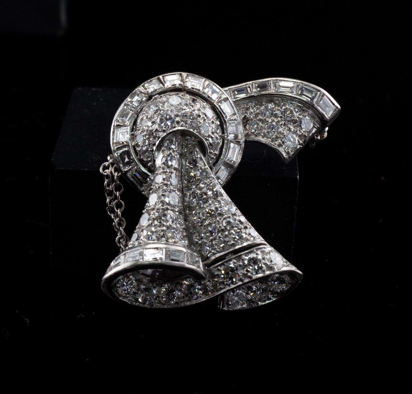 Diamond Pendant Brooch Platinum Vintage Bow 3.50ct DTW

This incredible highly collectible circa 1930s piece is finely crafted in solid Platinum (carefully tested and guaranteed). This piece made in the shape of pretty bow and can be worn as a