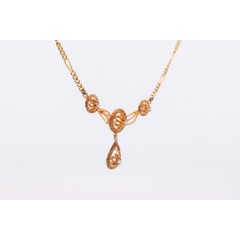 Diamond pendant lavaliere. 14k Gold with a diamond set buttercup necklace.