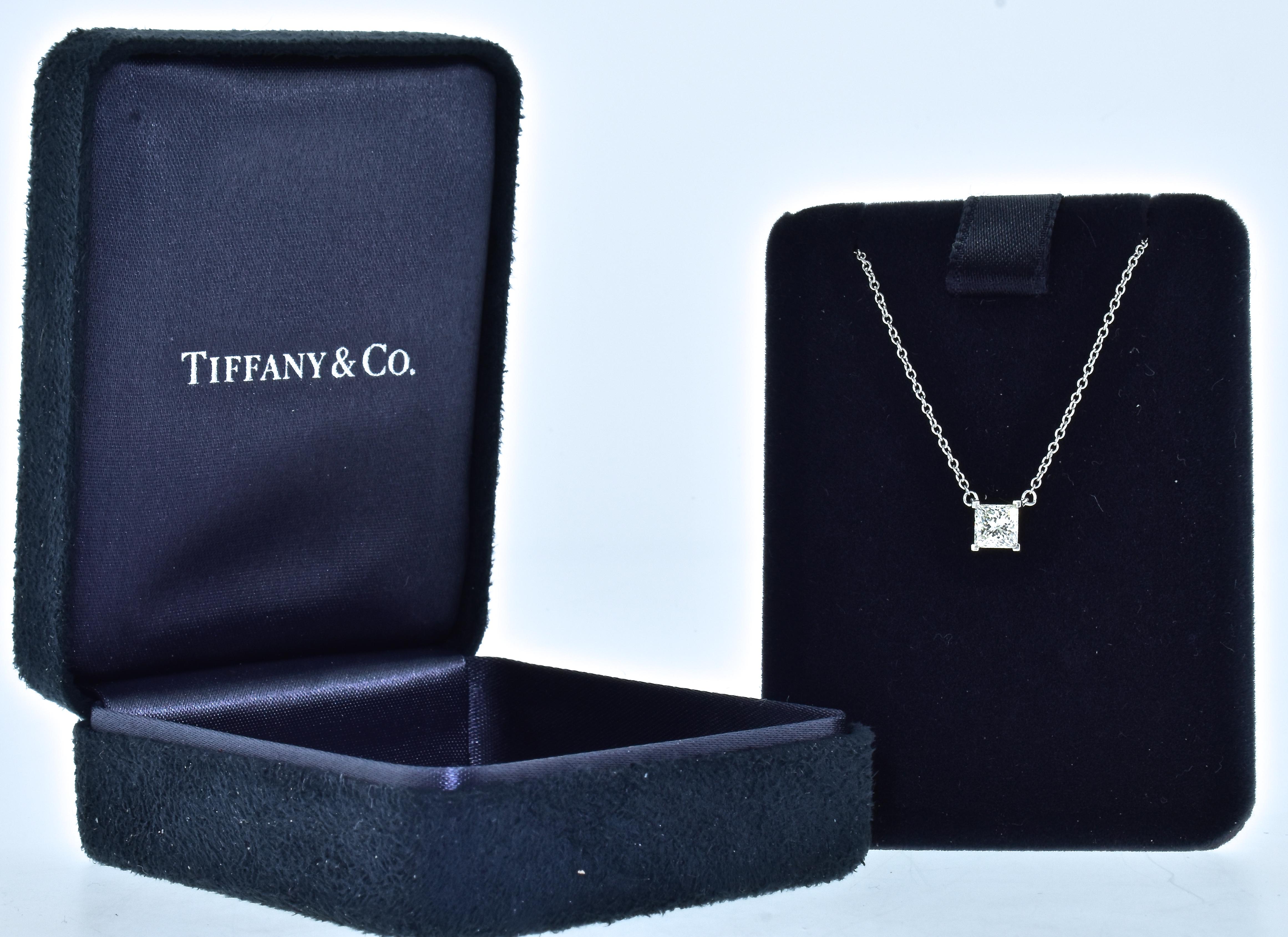 Tiffany & Co. platinum and fine diamond necklace all original, in fine condition and with the original box.  The fine white square radiant- cut diamond possesses fine symmetry, and is estimated to be near colorless (G), and very very slightly