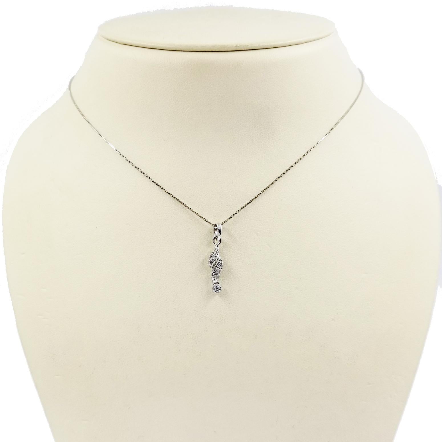 14 Karat White Gold Necklace Featuring A 7 Diamond Sliding Pendant Totaling 0.05 Carat with Beaded Milgrain Accents. 16 Inch Long Box Chain. Finished Weight is 1.5 Grams.