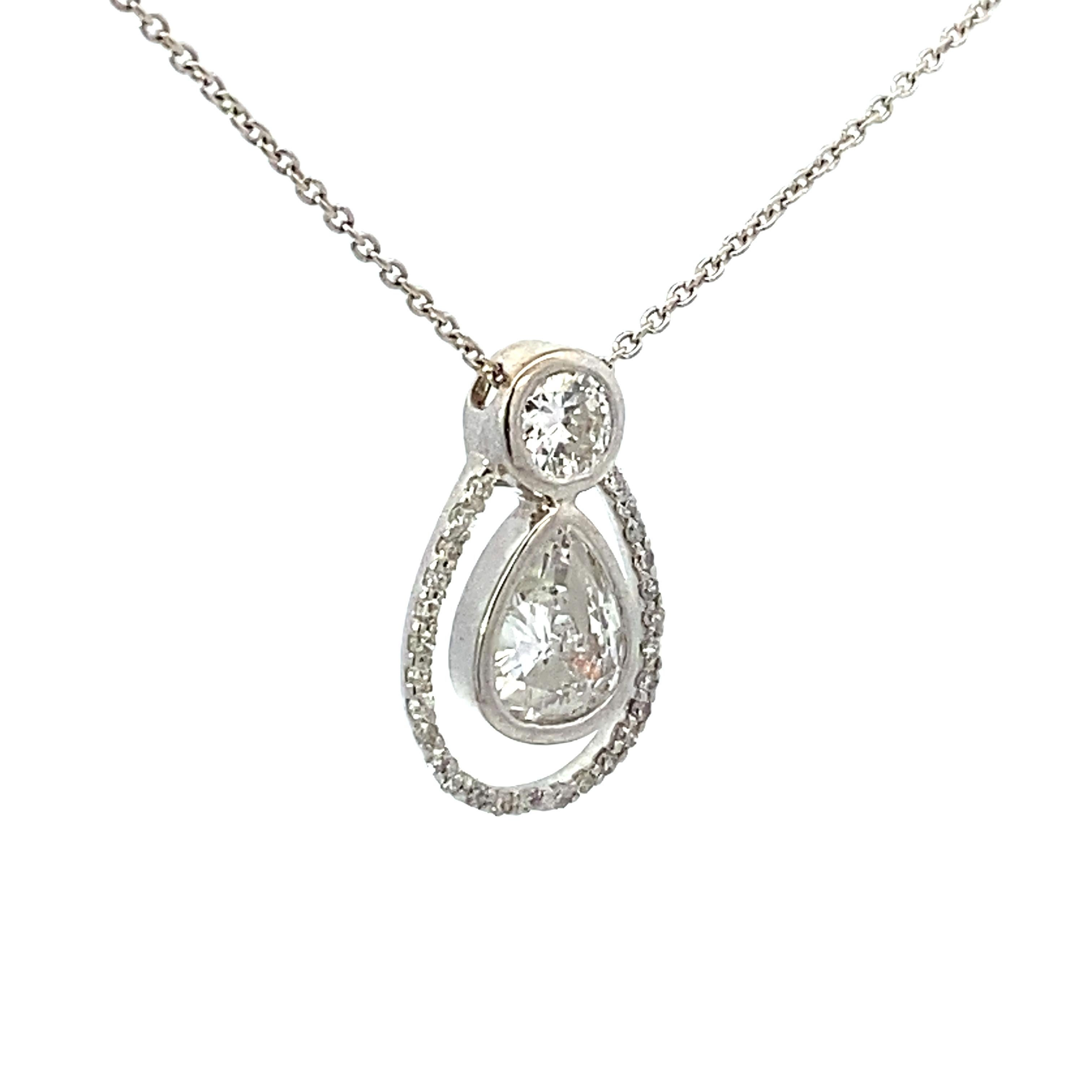 14k white gold drop pendant adjustable length 20 inch necklace with one 1.03 carat pear shape G Si2 diamond, one 0.30 carat round brilliant G Si1 diamond and 0.17 carat total weight accent diamonds.