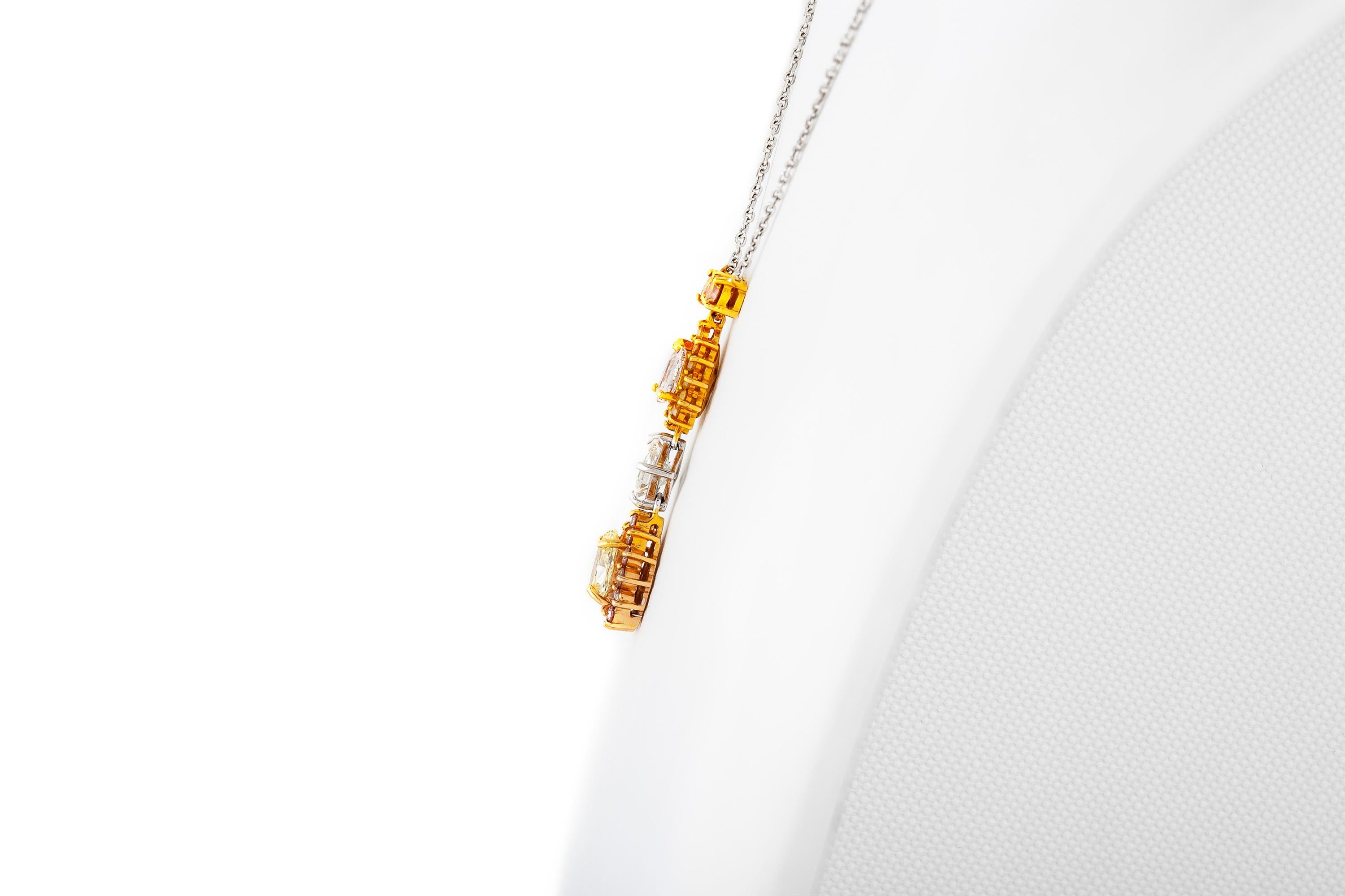 Pendant necklace, finely crafted in 18k gold and platinum with diamonds weighing approximately a total of 3.20 carats. Circa 2000.