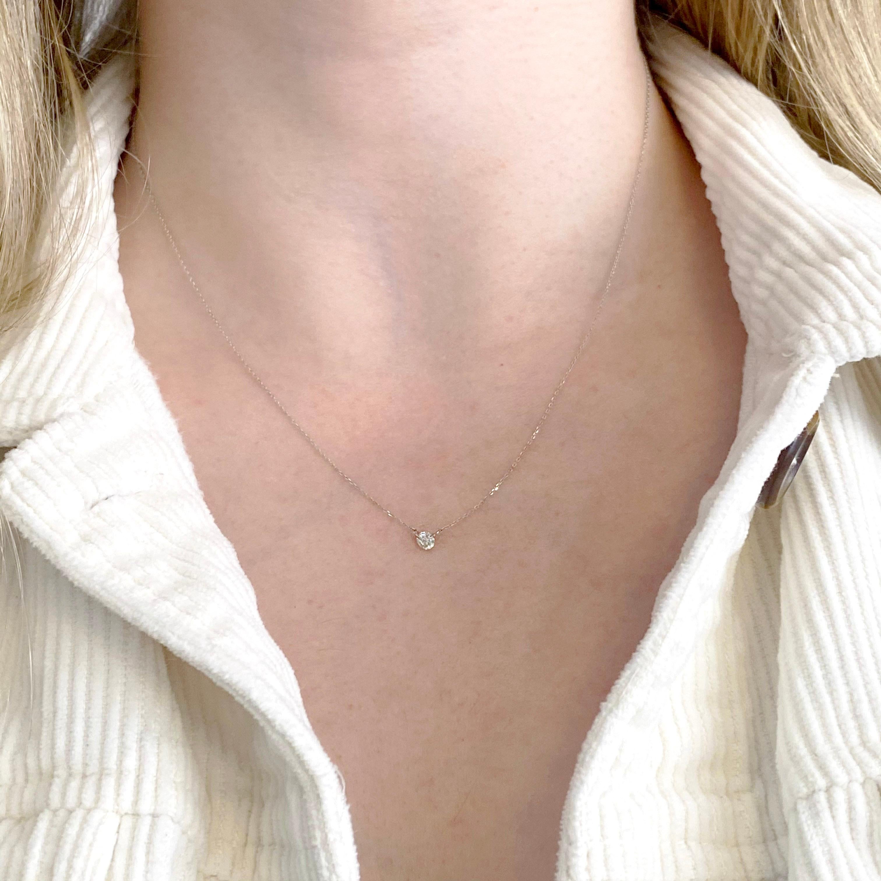 This 18K white gold diamond pendant is simple but elegant.  It has a full cut diamond that is .20 carats and very fine quality.  This is the perfect diamond necklace to wear to be chic but it is not so large that it will be the first thing that you