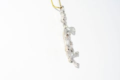Pendentif en or blanc 14 carats avec diamants représentant un joueur de tennis