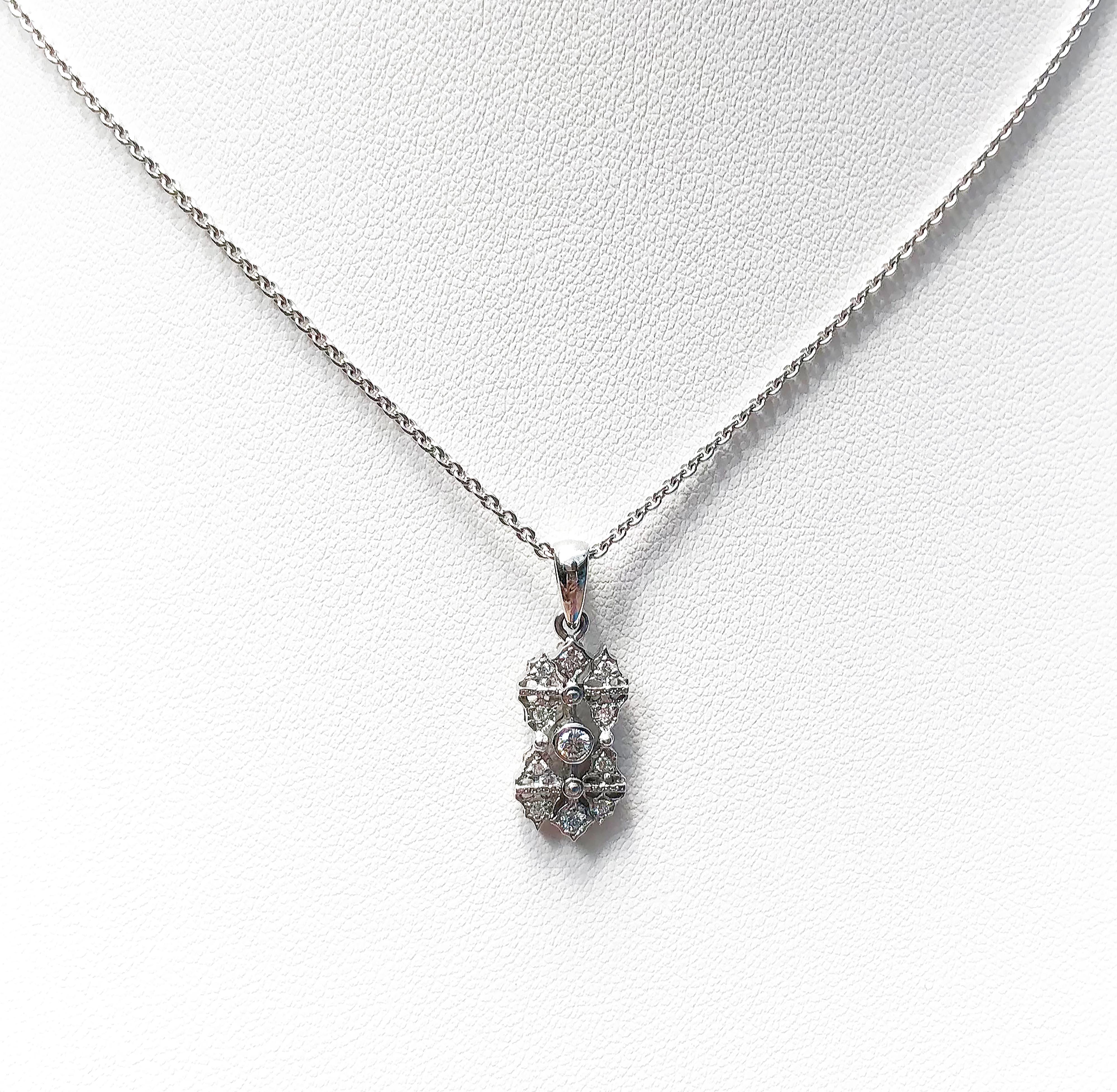 Diamond 0.18 carat Pendant set in 18 Karat White Gold Settings
(chain not included)

Width:  1.0 cm 
Length: 2.3 cm
Total Weight: 2.13 grams


