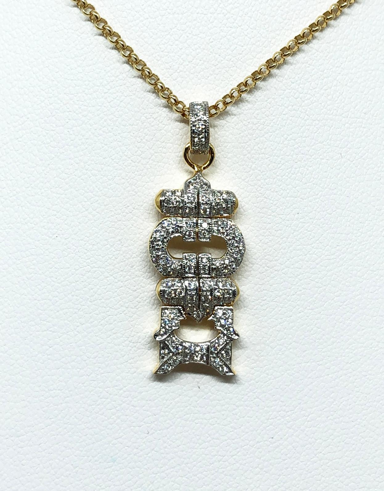 Pendentif en or 18 carats serti d'un diamant de 0,25 carat
(chaîne non incluse)

Largeur : 1.3 cm 
Longueur : 3.4 cm
Poids total : 4,41 grammes

