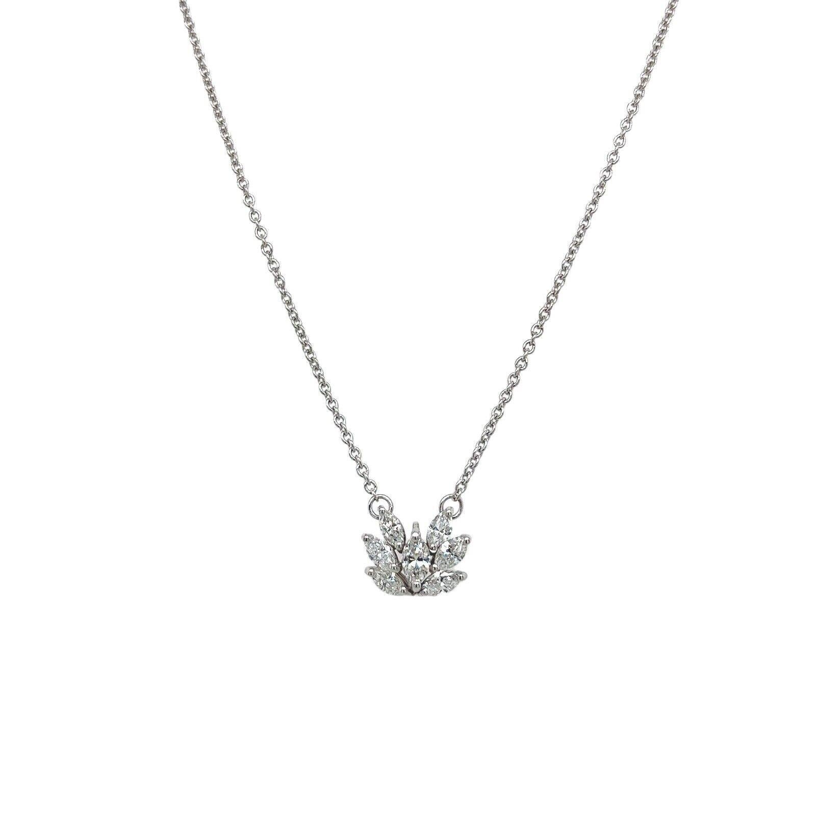 This gorgeous Diamond pendant is set with 7 marquise cut Diamonds in 18ct Gold, The pendant is suspended from a 14ct White Gold chain  that measures 18 inches, adjustable at 16