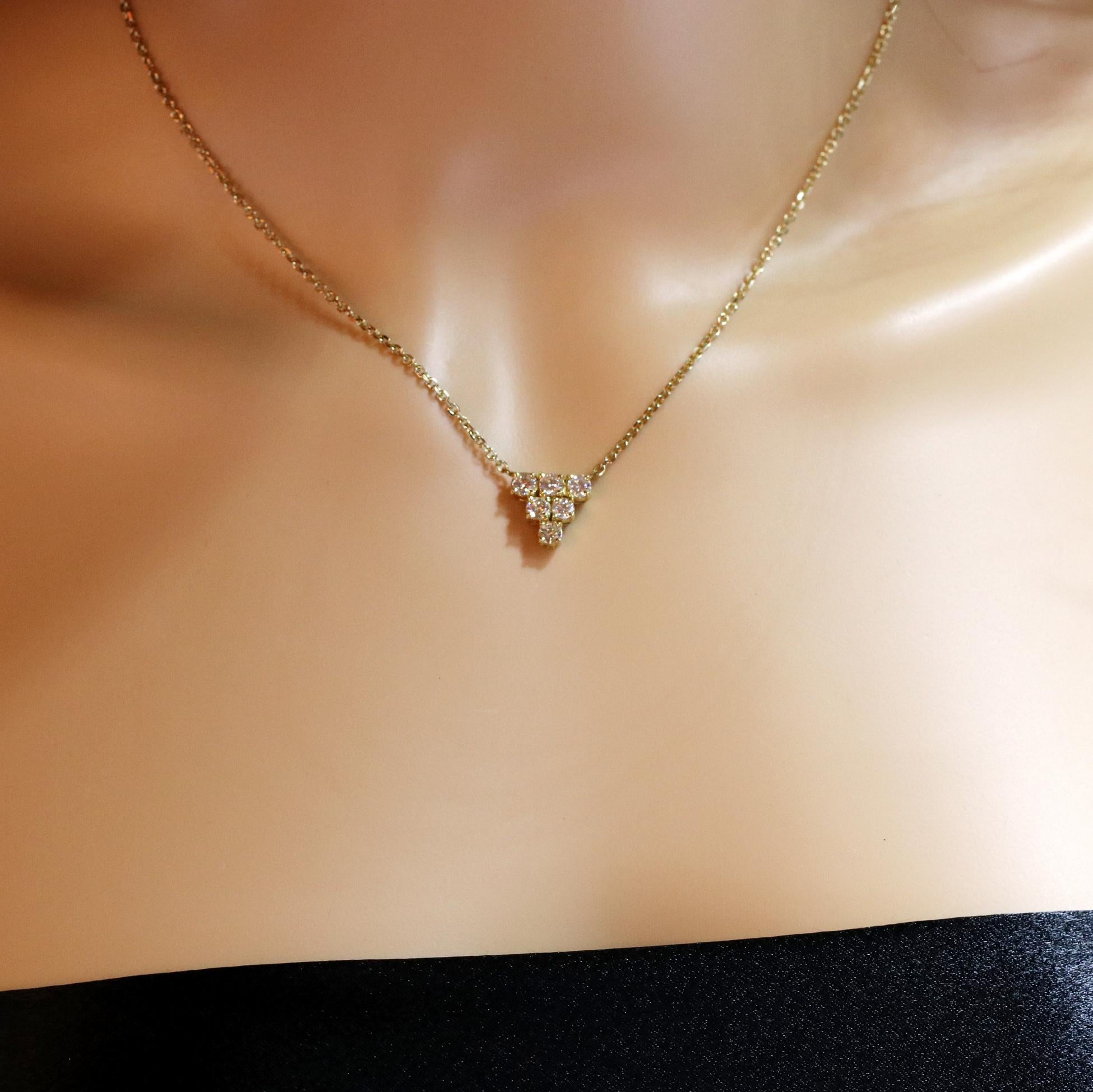 A 14 karat yellow gold necklace measuring 16 inches long, and set with 6 round brilliant cut diamonds weighing 1.15 carats total approximate weight, of overall G color and VS1/VS2 clarity. The necklace is a beautiful diamond cut, cable link. Overall