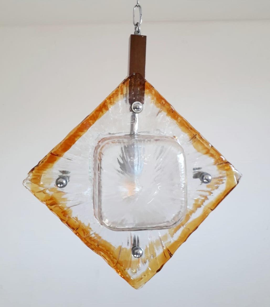Vintage Italian chandeliers or pendants with double clear and amber Murano glass diffusers enclosing a single light bulb at the center / Made in Italy by Mazzega, circa 1960s.
Measures: diameter 10 inches, pendant height 22 inches, total height 39.5