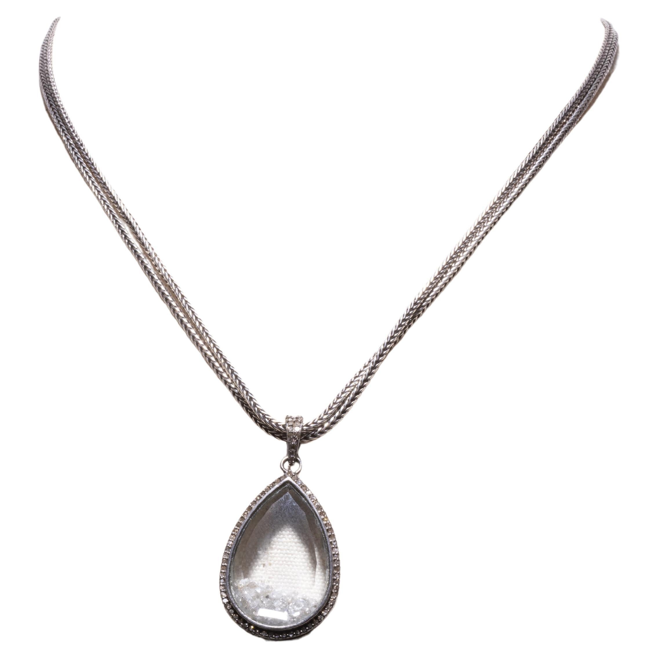 A cool and unusual beveled glass picture frame pear-shaped pendant with loose, faceted round diamonds inside and also along the border and the bail.  The chain is a hand-rolled sterling silver chain.  You can wear this short by doubling the chain