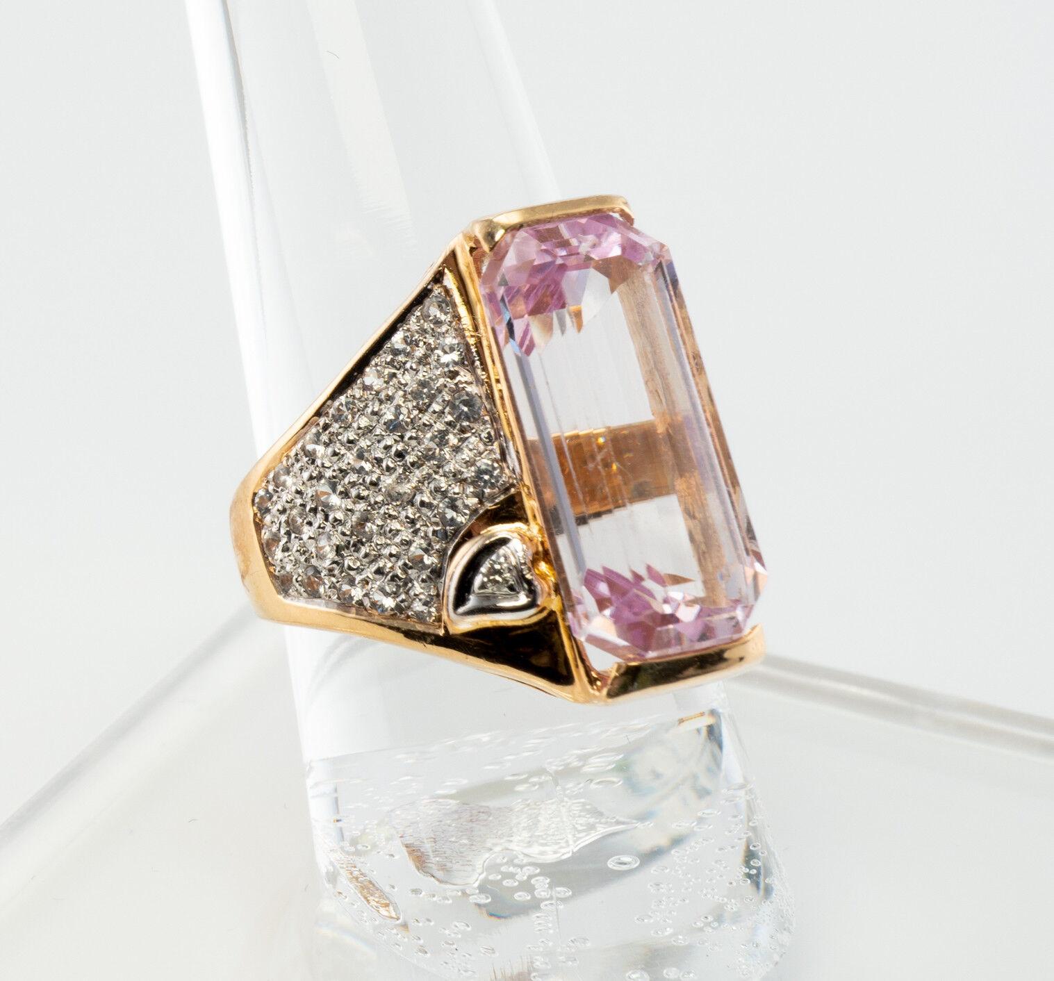 This gorgeous estate ring is finely crafted in solid 14K gold and set with genuine Pink Kunzite and Diamonds. The center gem is 18mm x 9mm and it is a very clean and transparent stone of great intensity and strong brilliance. Fifty-four diamonds are