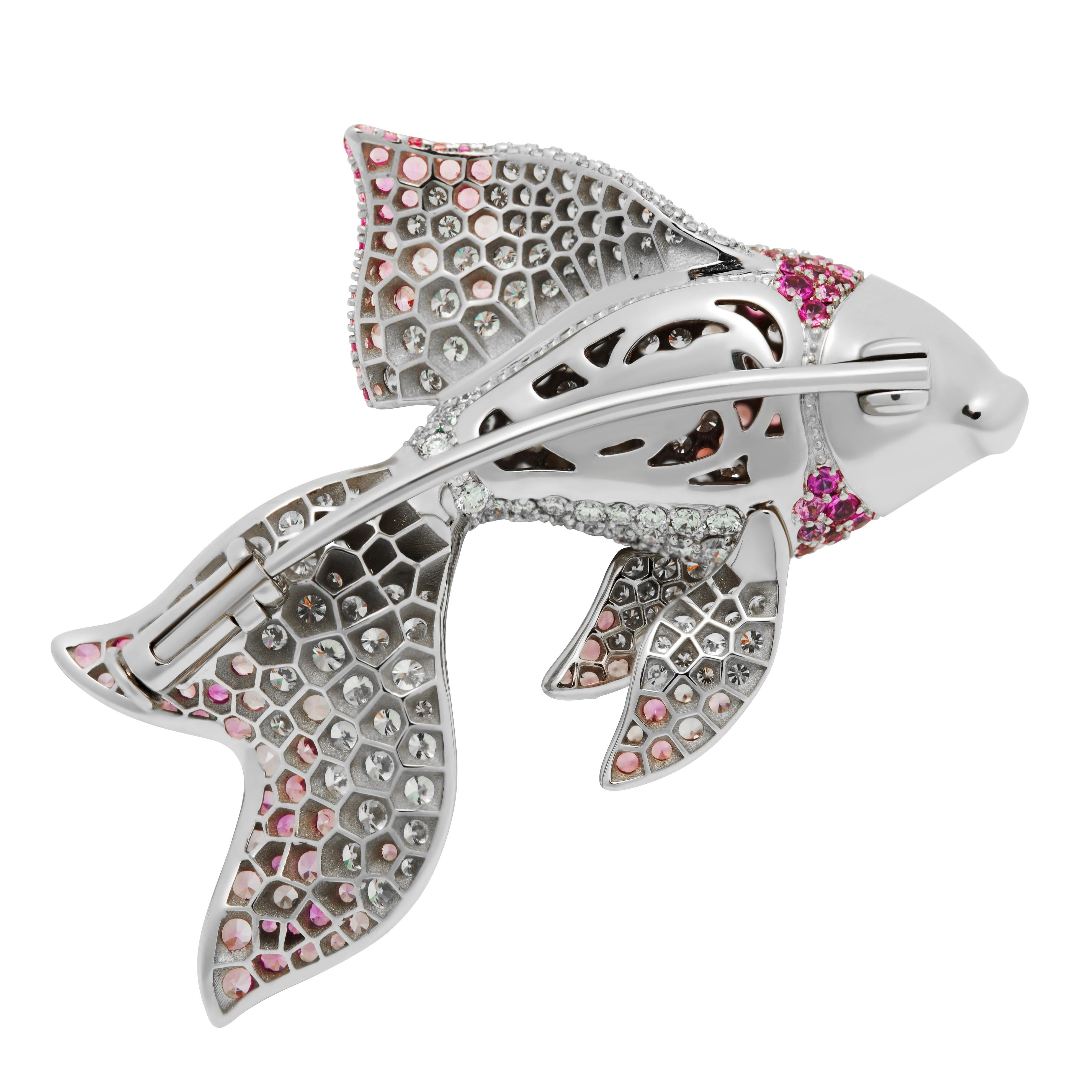 Diamond Pink Sapphire 18 Karat White Gold Golden Fish Brooch

Crafted from the finest 18-karat white gold, this brooch features stunning diamonds and pink sapphires arranged to form a graceful golden fish. The intricate design is complemented by the