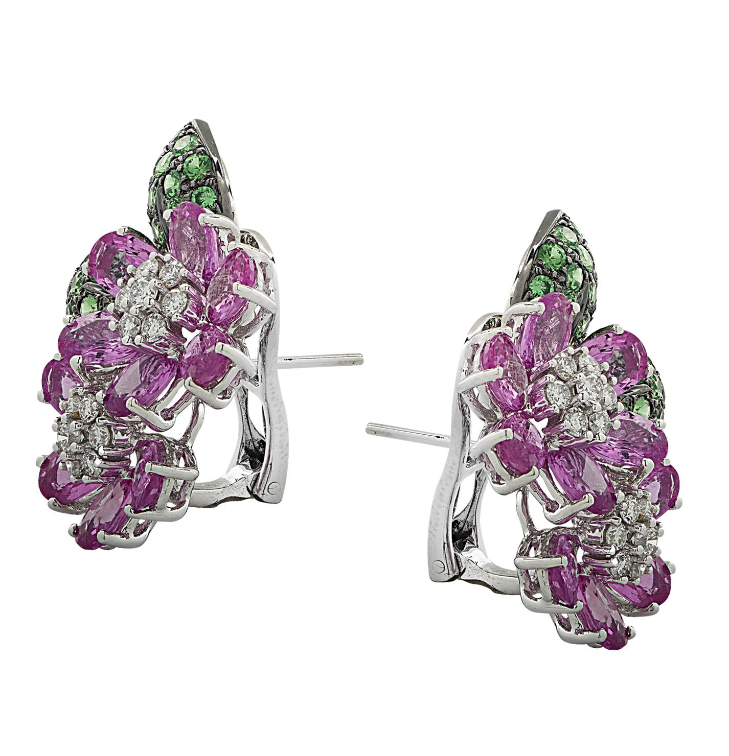 Enchanting earrings crafted in 18 karat white gold with black rhodium, featuring 20 oval pink sapphires weighing approximately 11.15 carats total, 50 round tsavorites weighing approximately 1.78 carats total and 28 round brilliant cut diamonds