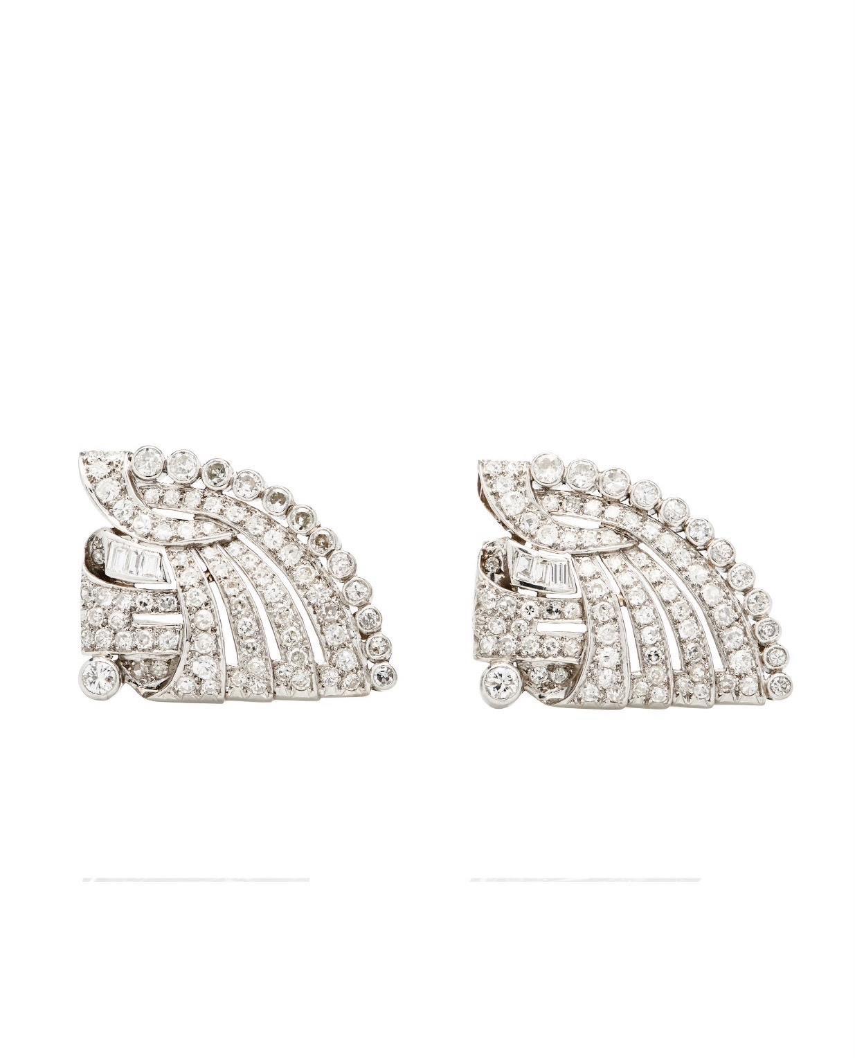 A showstopper bracelet! Original Art Deco dress clips can now be worn as a stunning one - of - a- kind Hefty Cuff Bracelet.
The original clips have approx 7.25+ carat diamonds set in platinum. They detach from a sold 18k custom cuff. Style it your