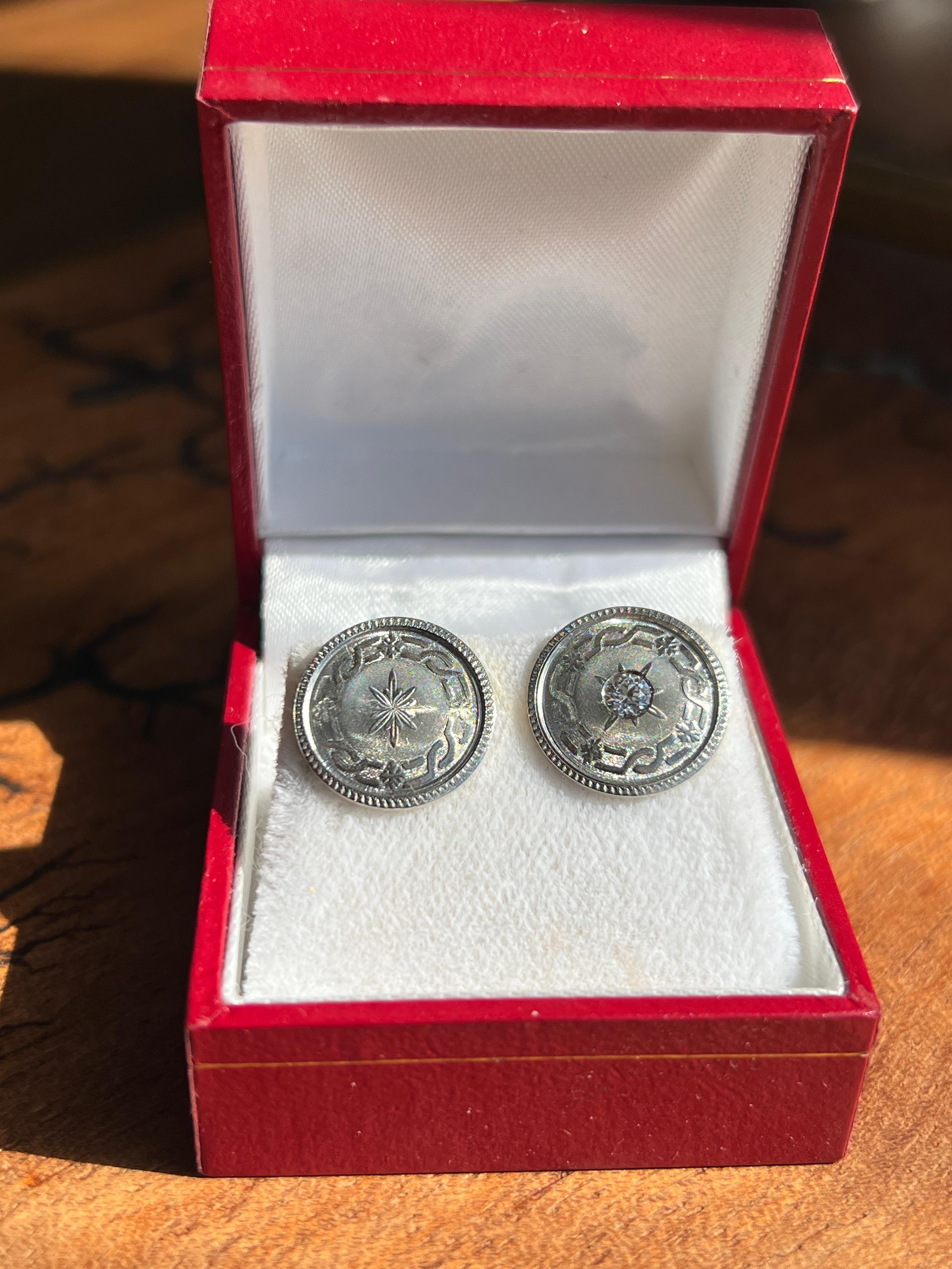 These unique earrings, converted from circa 1915 transitional-era cufflinks, bring a touch of vintage sophistication to a modern accessory. Crafted from 14 karat yellow gold with a platinum top, each earring measures 5/8 inch diameter with a