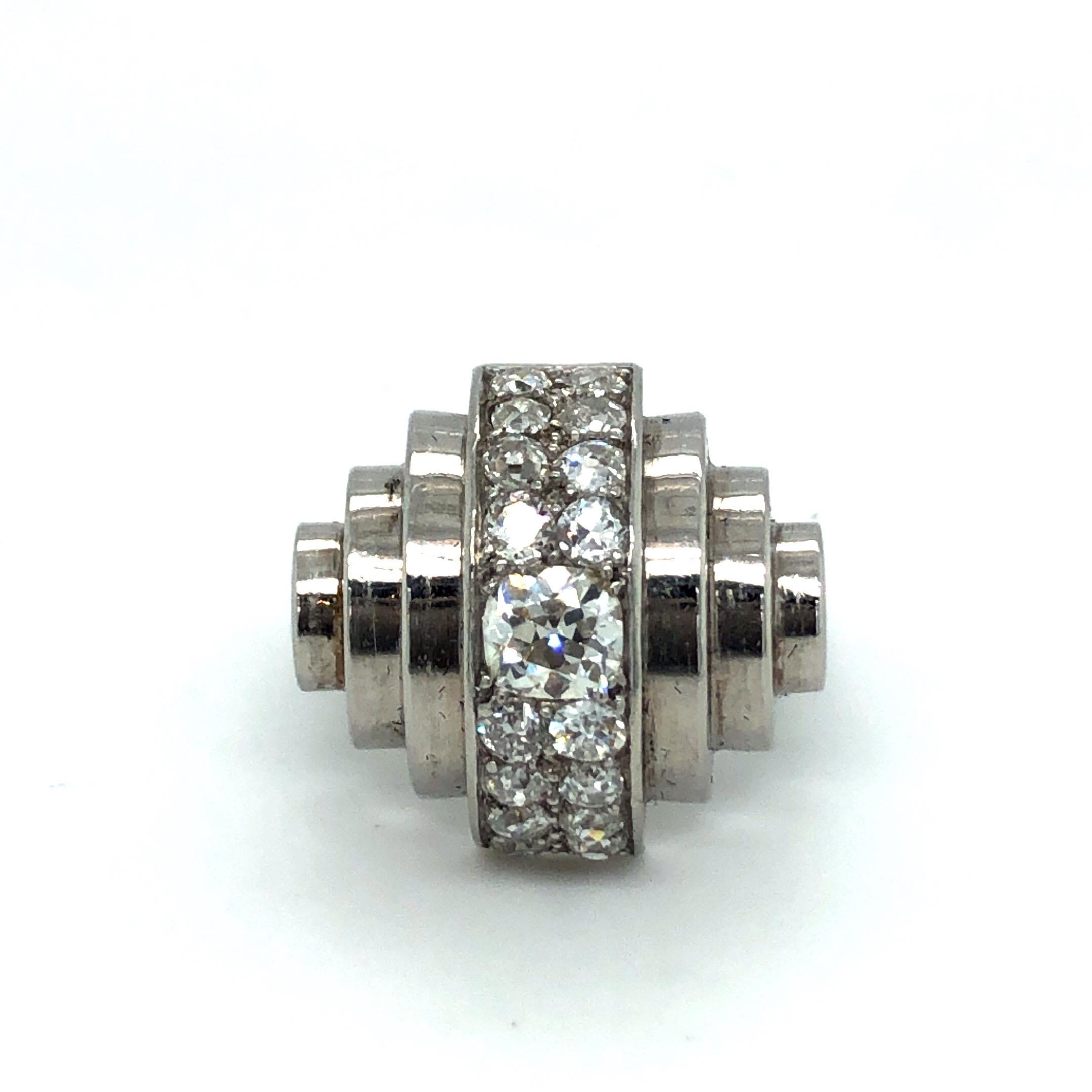 Dazzling diamond and platinum ring by Suzanne Belperron for René Boivin, 1932.
Of stepped design, crafted in platinum and set with a row of 17 old-cut diamonds totallling circa 1.5 carats, this iconic ring perfectly embodies the spirit of the