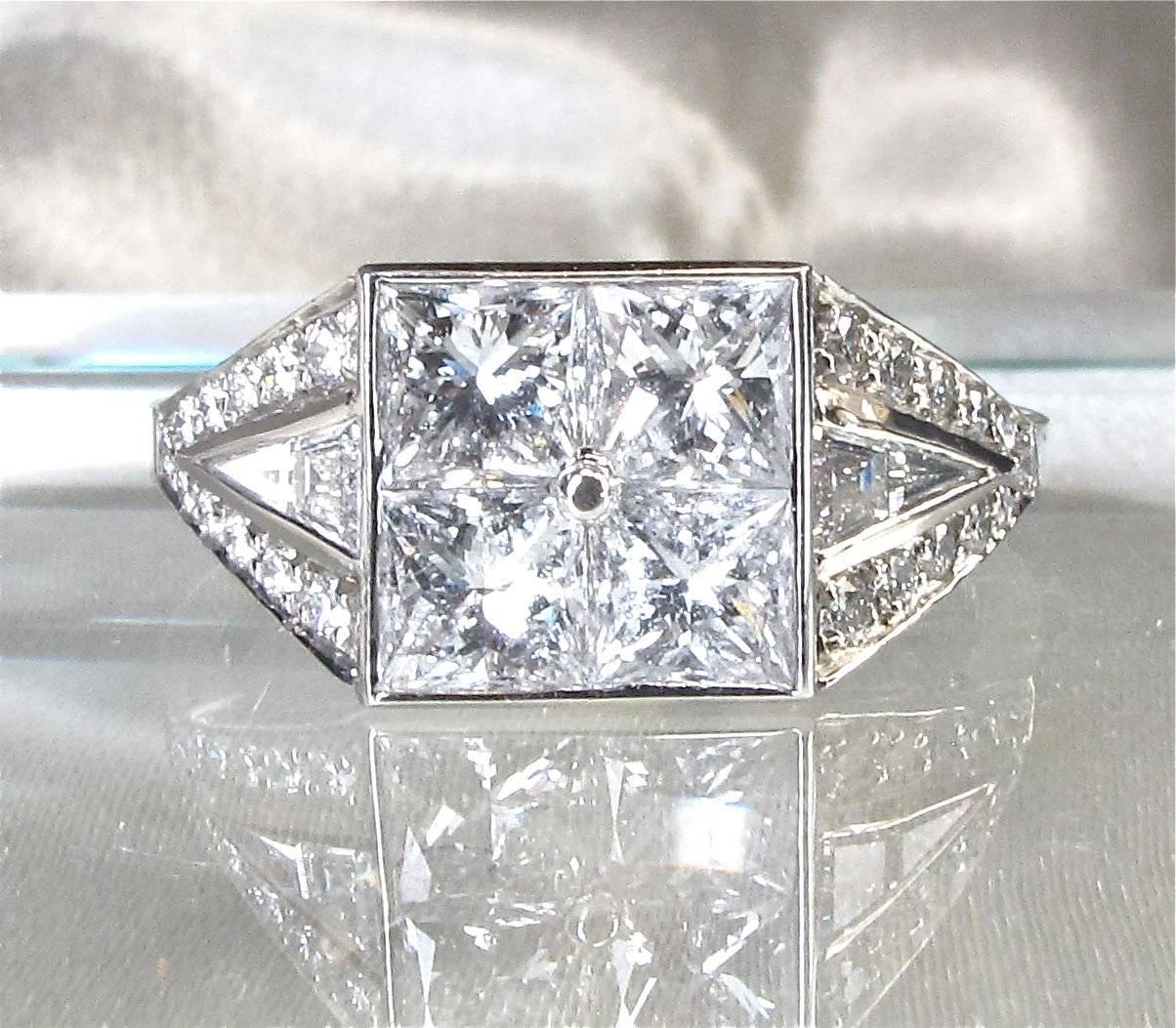 Diamond Ring in Art Deco Style
4 princess cut diamonds 1.65 cts
round diamonds 0.19 cts
fancy diamonds 0.17 ct
mounted in platinum
ring size 54 (size can be adjusted 2 sizes down or up free of charge)