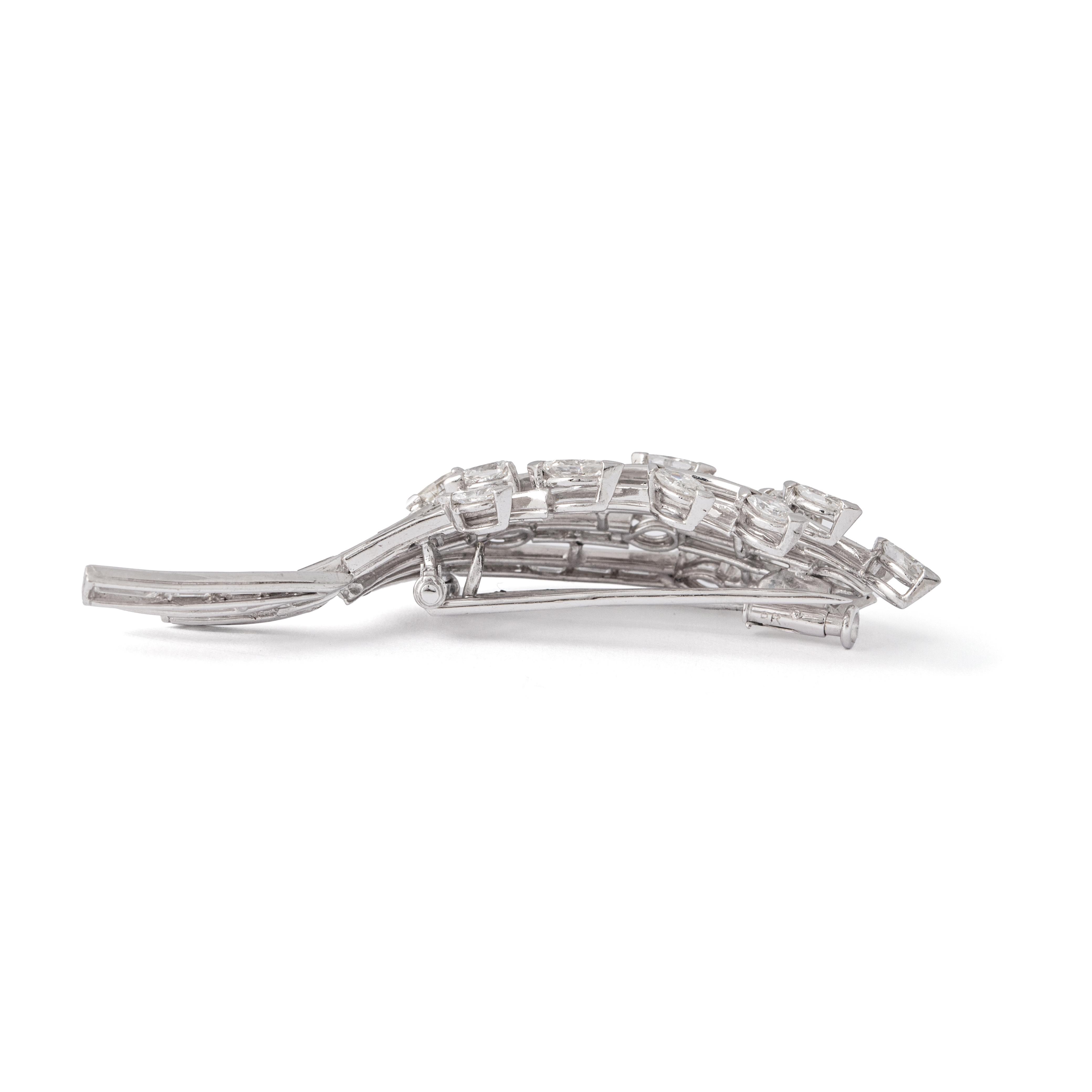 Diamond and Platinum Brooch.

Elevate your style with this captivating Diamond and Platinum Brooch, adorned with a mesmerizing combination of diamonds. Featuring a brilliant 2.25-carat pear-shaped and marquise-cut diamonds, alongside 3.85 carats of