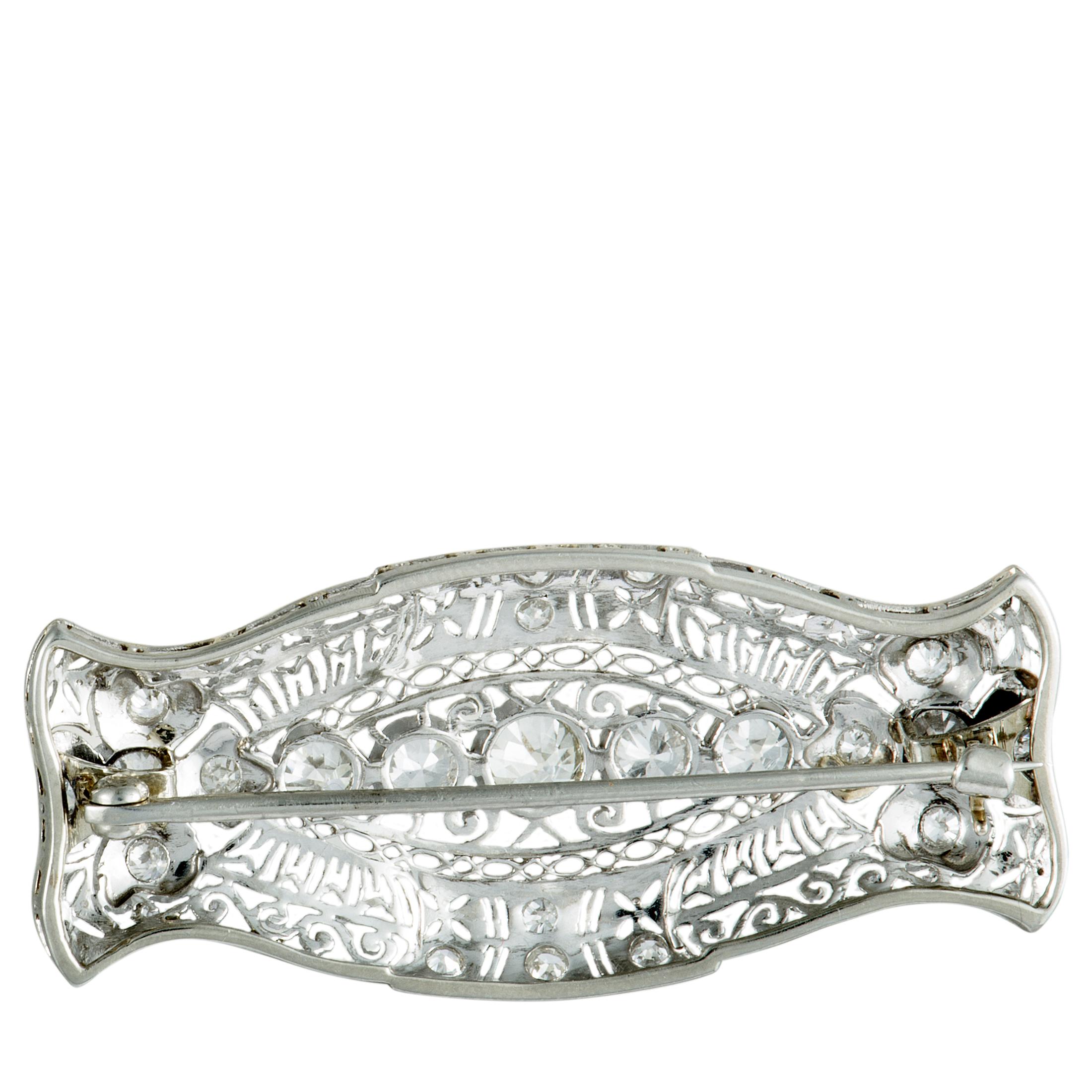 Boasting an exceptionally sophisticated design and superb craftsmanship quality, this wonderful brooch epitomizes timeless elegance and prestigious refinement. The brooch is beautifully made of platinum and it is embellished with irresistibly