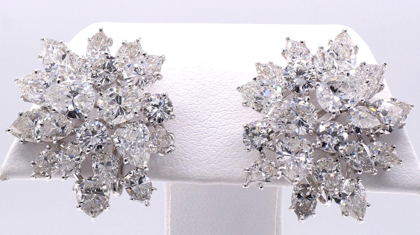 Beautifully designed and masterfully handcrafted in platinum, these important Winston style diamond ear clips are beautifully set on multi levels to give them a magnificent three dimensional appearance on the ear. Set with 30 pear shape diamonds and