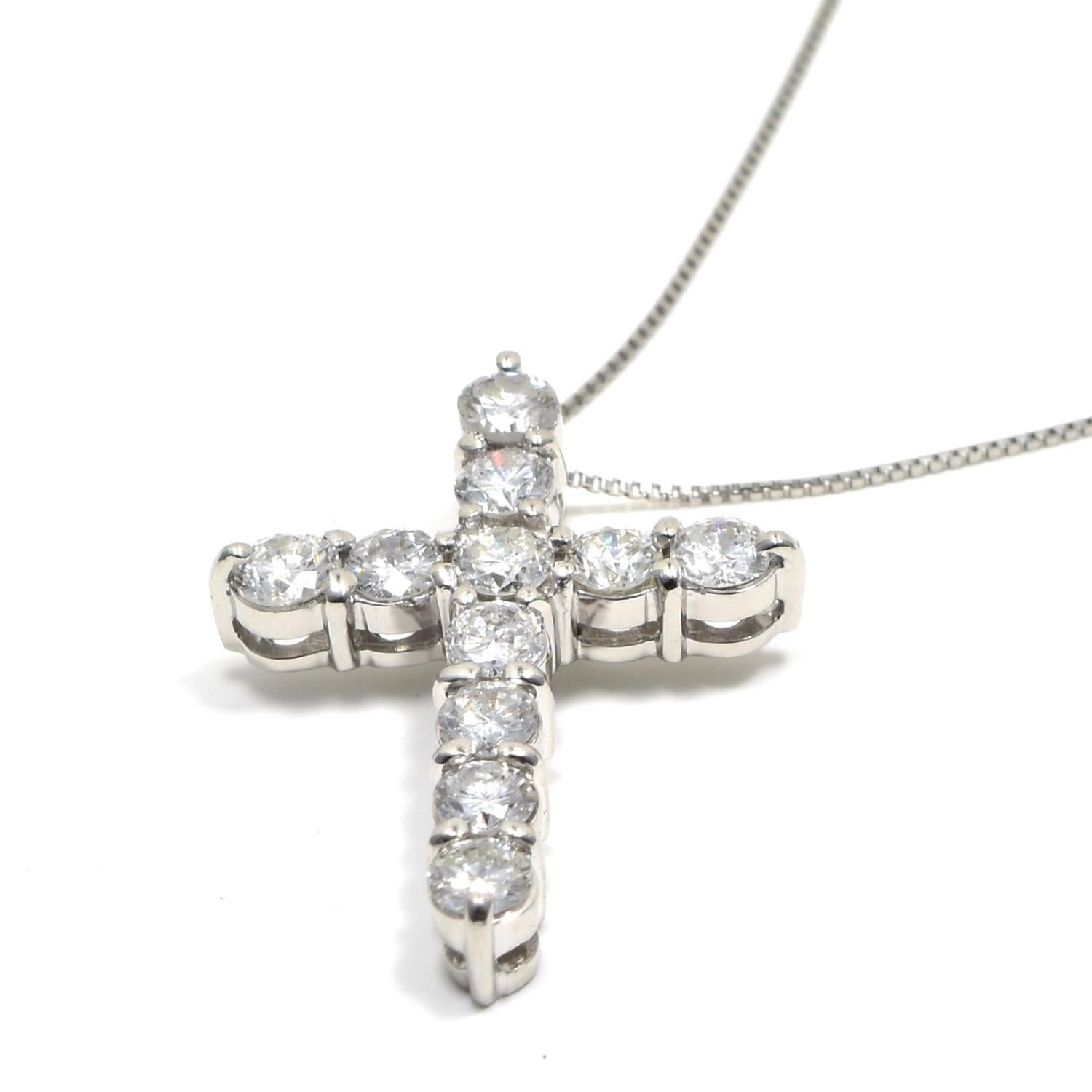 Style: Pendant

Theme: Cross & Religion

Metal: Platinum

Stone:  Round Diamond

Total Carat Weight: 1.5 ctw

Total Item Weight (grams): 6.3 g

Cross Width: 2 cm

Chain Length: 16 inches

Includes: Brilliance Jewels Pouch
