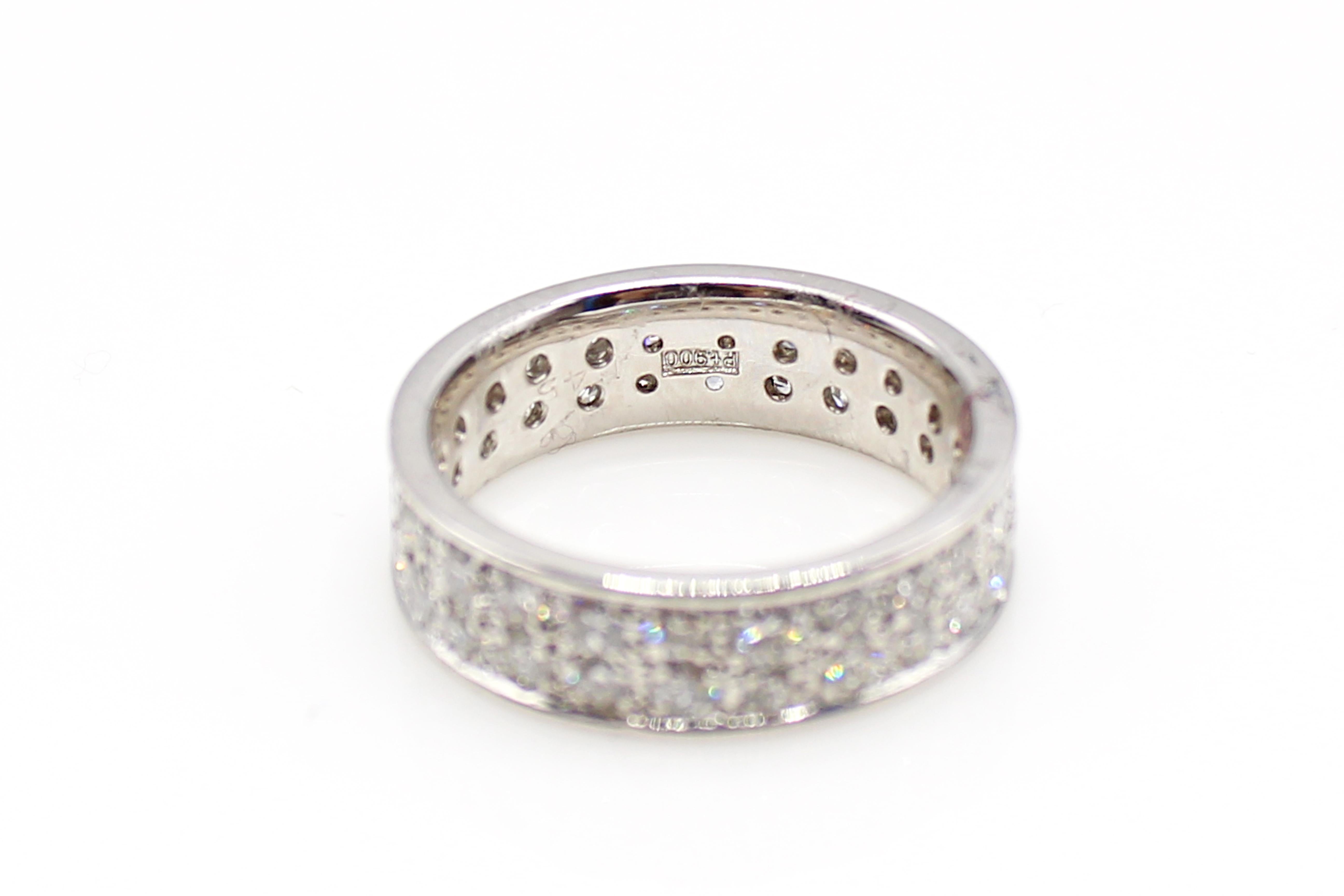 Beautifully hand-crafted in platinum this twin-row diamond eternity band is finely set with 48 bright, white and sparkly round brilliant cut diamonds. Each diamond is perfectly matched to give a harmonized appearance of flowing white. The average
