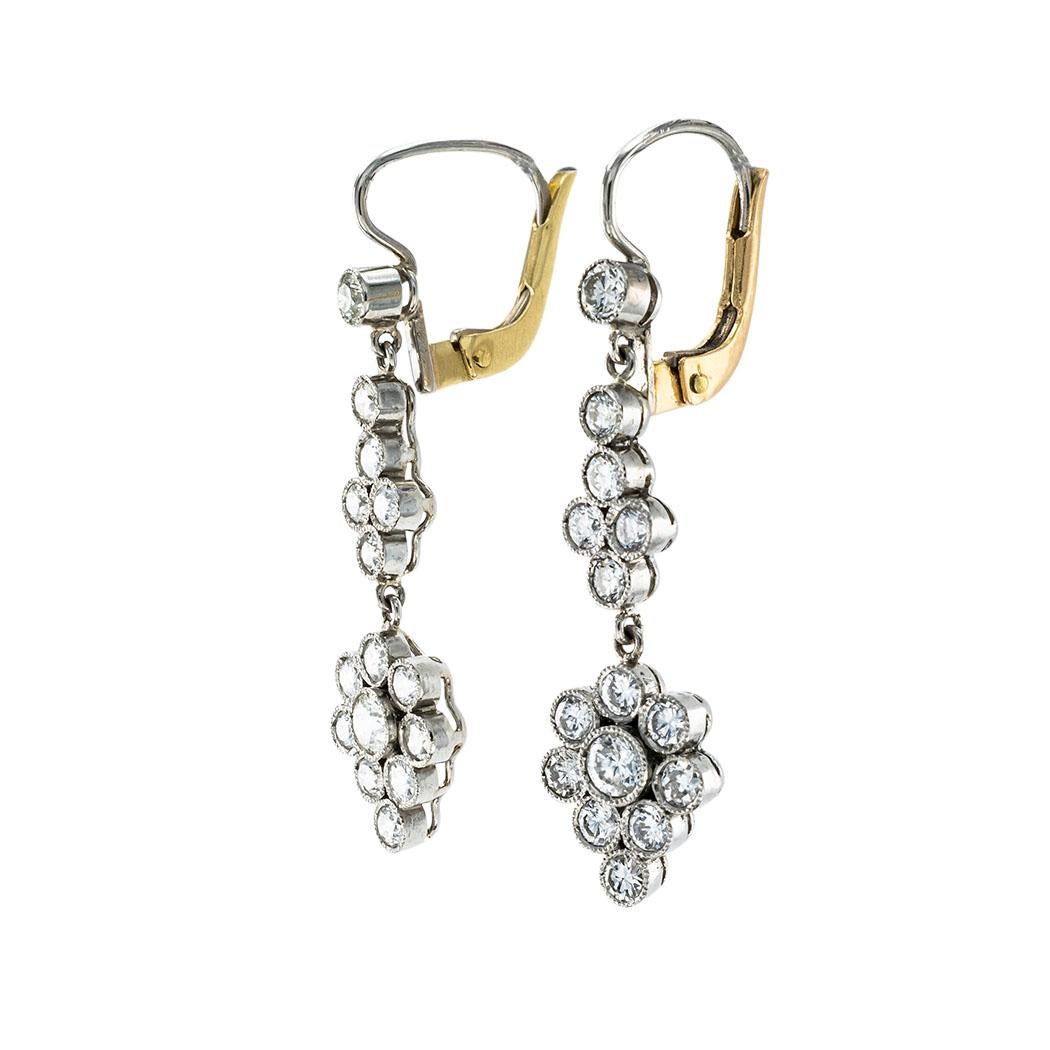 Diamond and platinum articulated drop earrings.  

Contact us right away if you have additional questions.  We are here to connect you with beautiful and affordable antique and estate jewelry.

SPECIFICATIONS:

DIAMONDS:  thirty round brilliant-cut