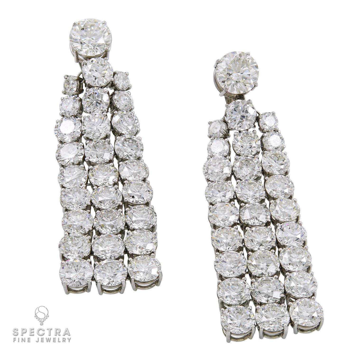 These Diamond Waterfall Drop Earrings made by Spectra Fine Jewelry in the 21st century, circa 2010s, have a classic design with a dramatic effect. Approximating an actual waterfall, the colorful sparkle of the diamonds refracts the light into