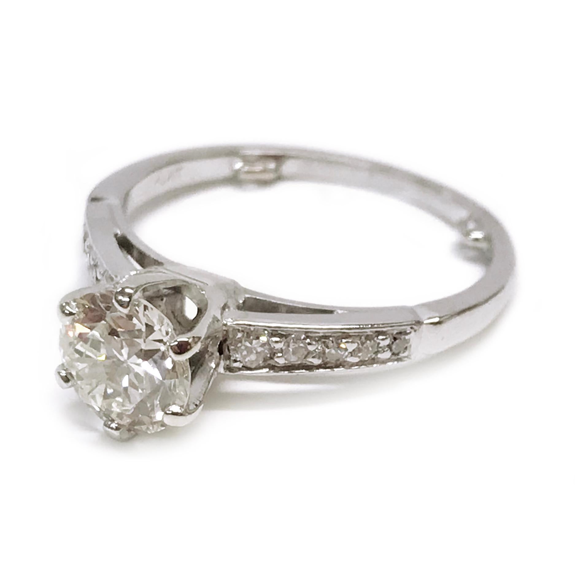 Diamond Platinum Engagement Ring, size 5.75. The center six-prong round Old European-cut diamond measures 6.39mm x 6.32mm x 3.79mm for a carat weight of 0.99ct. The diamond is I2 (G.I.A.) in clarity and K (G.I.A.) in color. Five graduate bead-set