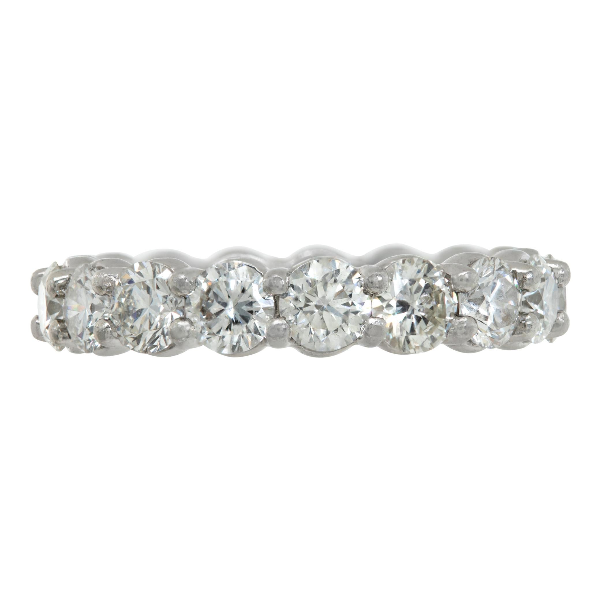 Diamond eternity band in platinum with approximately 2.72 carats in round diamonds (H color, VS clarity). Ring size 4.75.