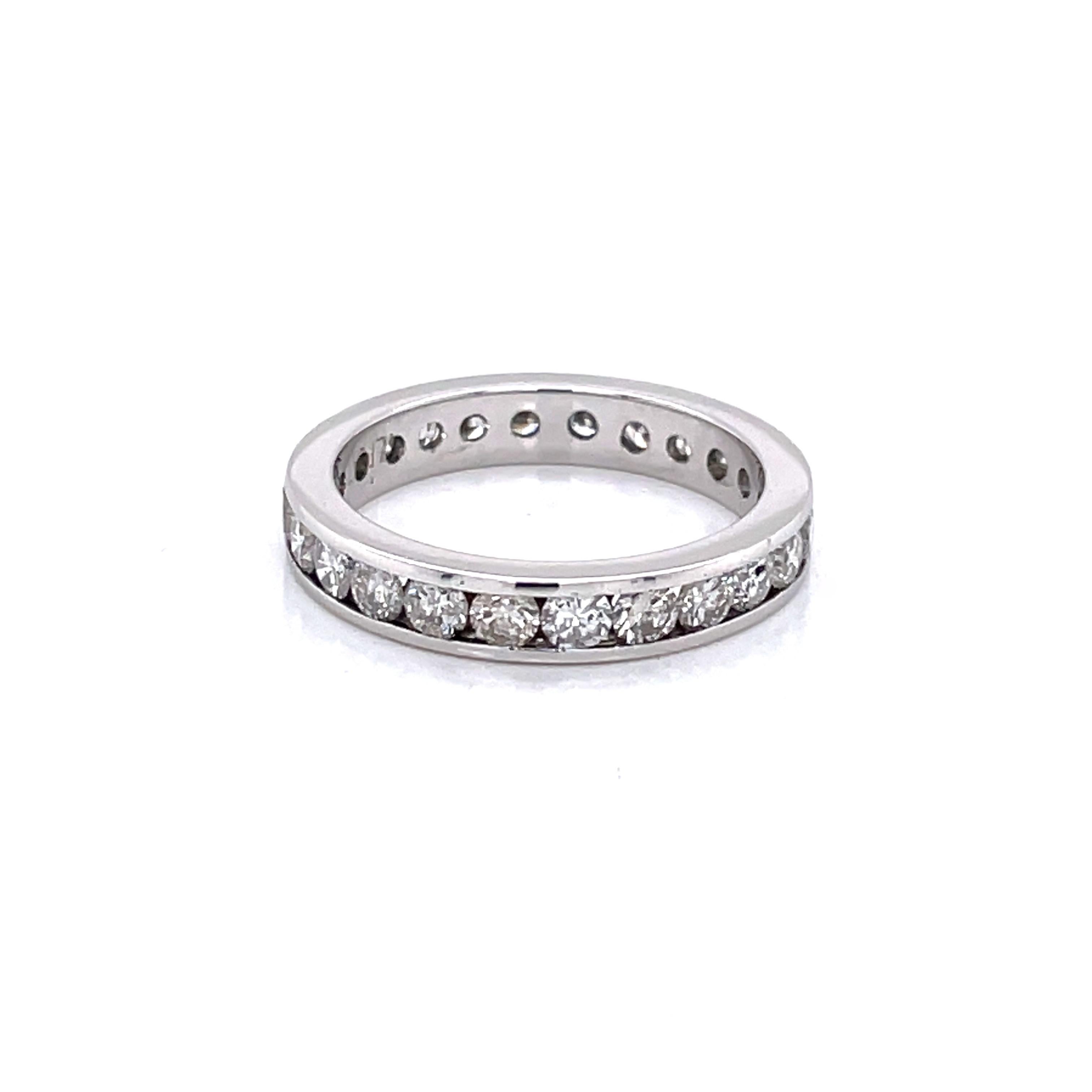 Twenty four .05 carat round faceted H/VS diamonds, 1.20 carats total weight, are infinitely channel set along this platinum band to signify eternal love.
This ring is versatile to wear on its own or to stack as a complement to other significant