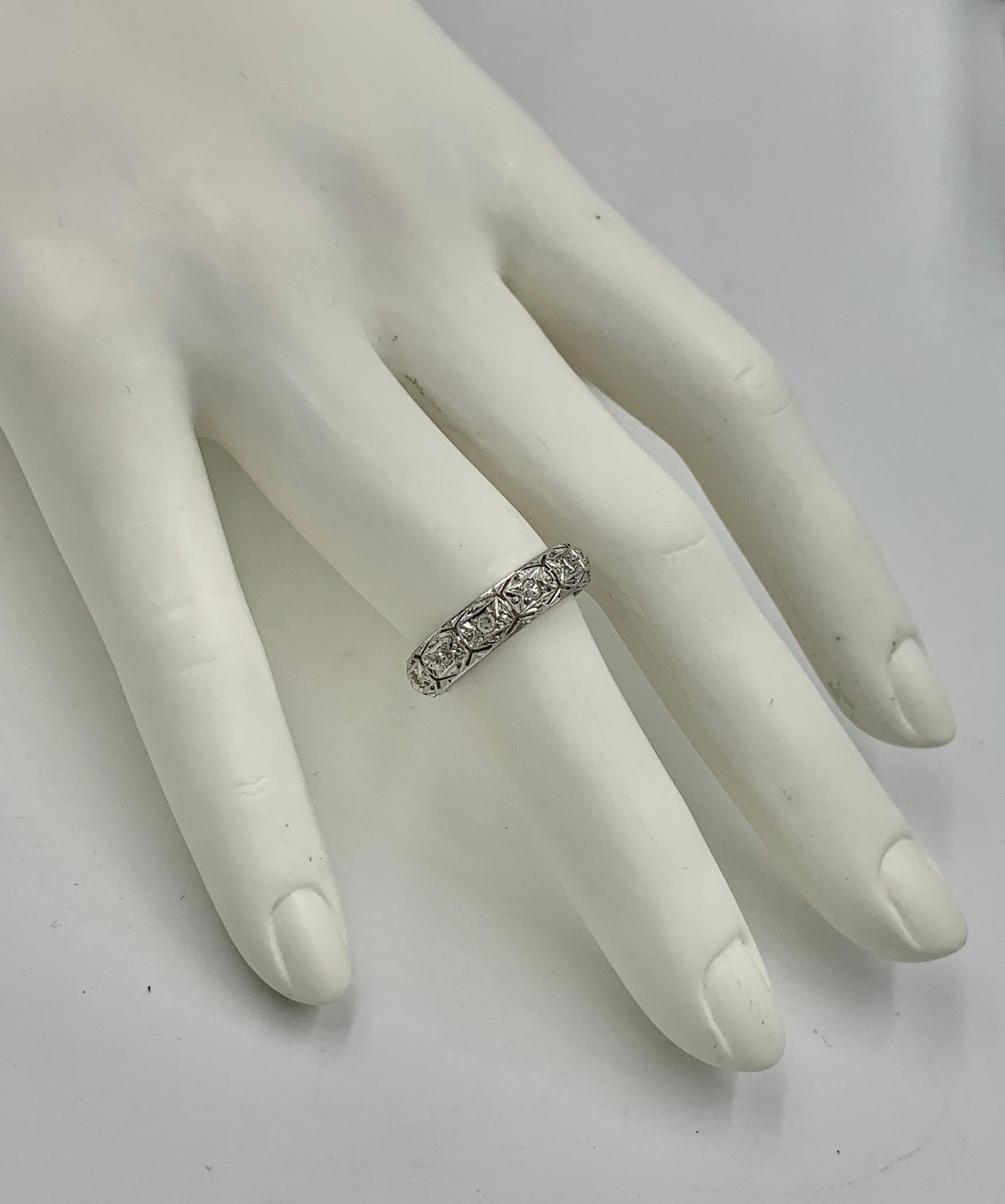 An Antique Diamond Platinum Eternity Band Wedding Engagement Stacking Ring.  The Size 6 ring has 13 Round Brilliant Cut Diamonds which are beautifully set in the Platinum open work band ring.  I just love the open scroll work design with the