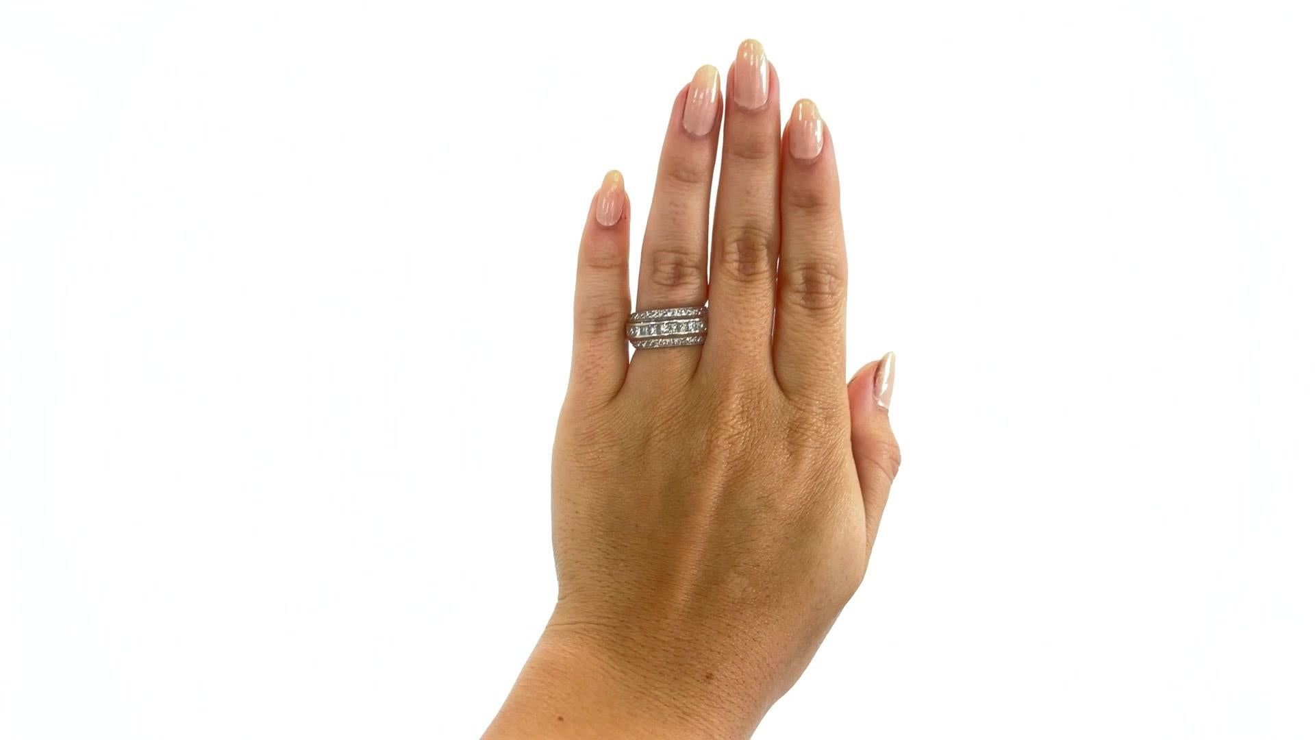 Timeless elegance radiates from this diamond platinum eternity band. Featuring a fascinating combination of 29 princess cut diamonds infused with two round cut diamond bands weighing approximately 3.50 carats total and are H-I color, VS clarity.