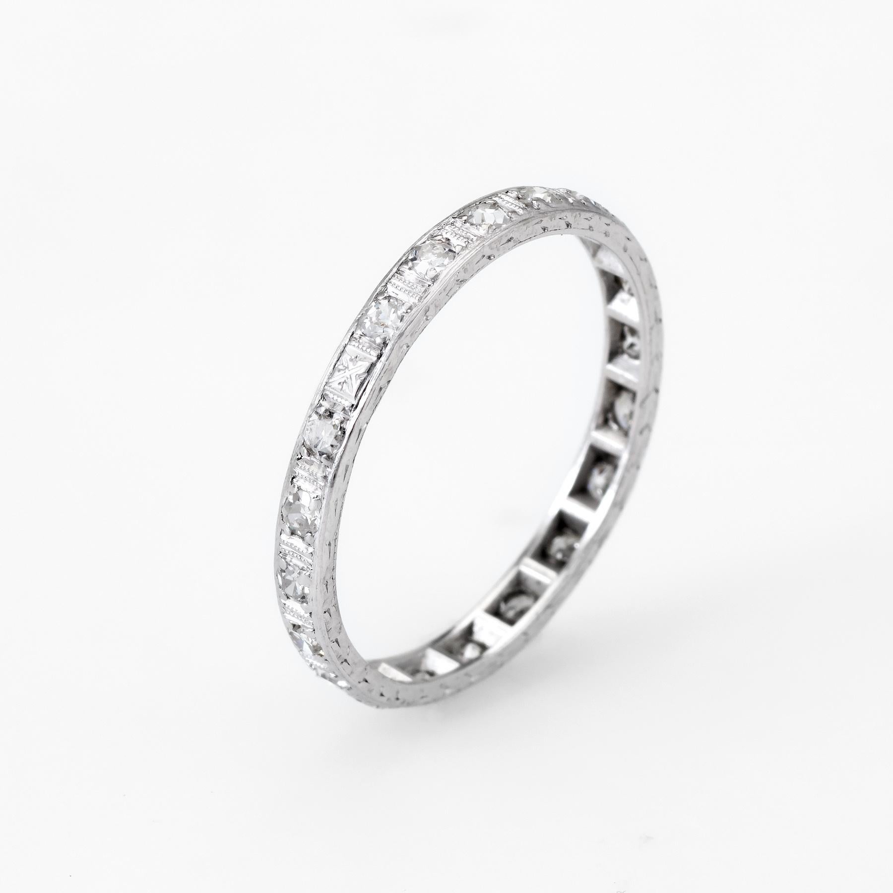 Finely detailed vintage eternity ring (circa 1920s to 1930s), crafted in 900 platinum. 

Single cut diamonds are estimated at 0.01 carats each. The total diamond weight is estimated at 0.20 carats (estimated at G-H color and VS2-SI1 clarity).    