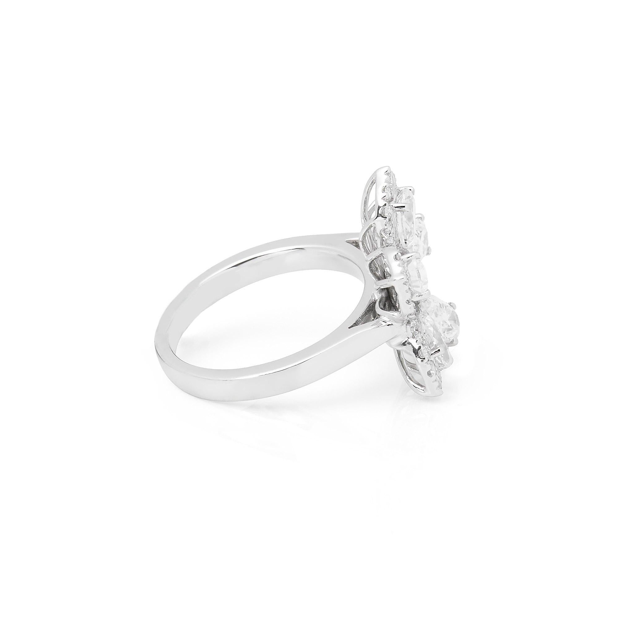 This Ring features Five Pear Cut Diamonds Totalling 1.57cts with Micro Set Round Briliant Cut Diamonds to the outer edge totaling 0.67cts. Set in Platinum. Ring size UK L1/2, EU Size 52, USA Size 6. Complete with Xupes Presentation Box. Our Xupes