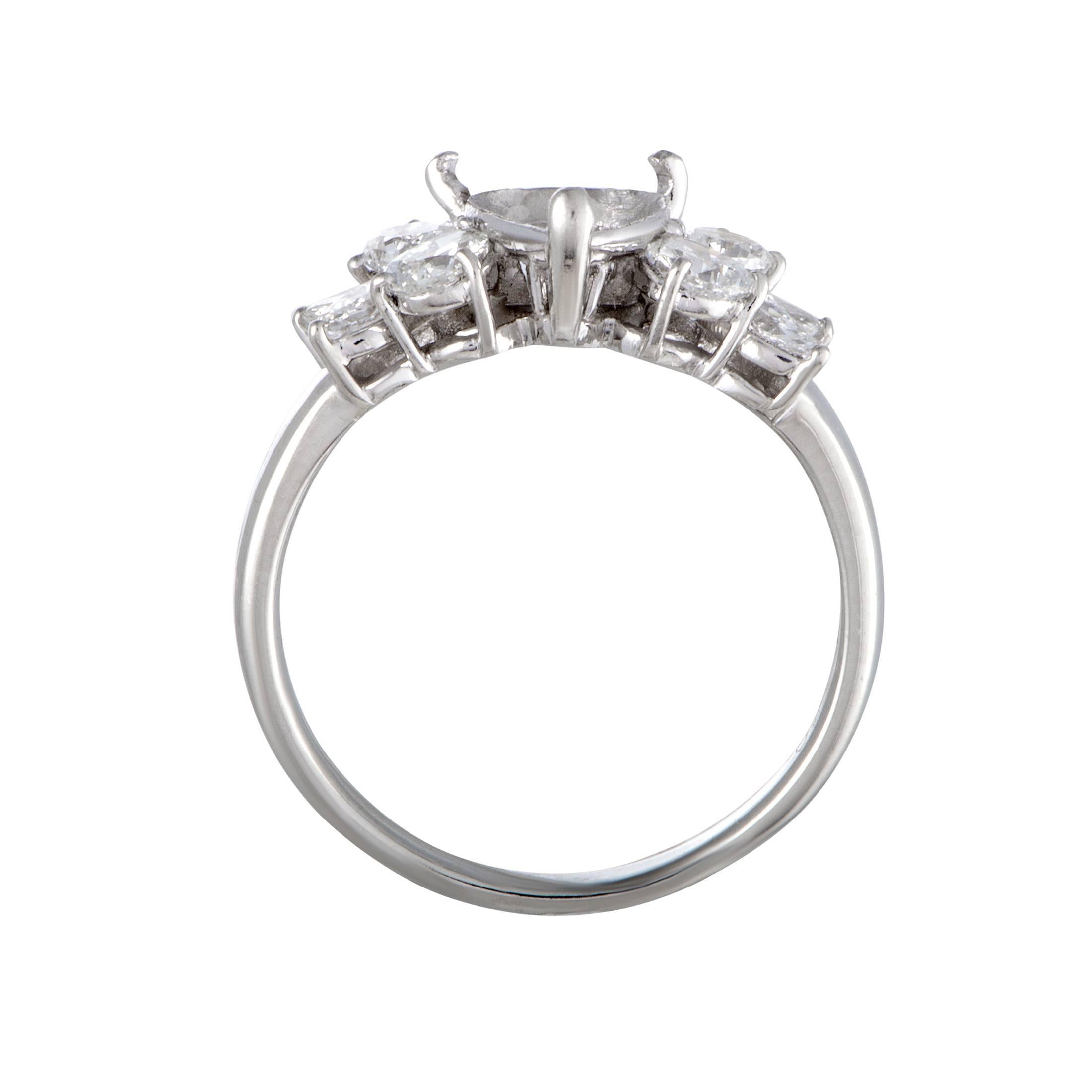 This superb mounting ring is made of platinum and features an endearingly feminine design. The ring is beautifully embellished with exquisitely cut diamond stones that weigh 1.10 carats in total.
Ring Size: 8.75
Band Thickness: 2mm
Ring Top Height: