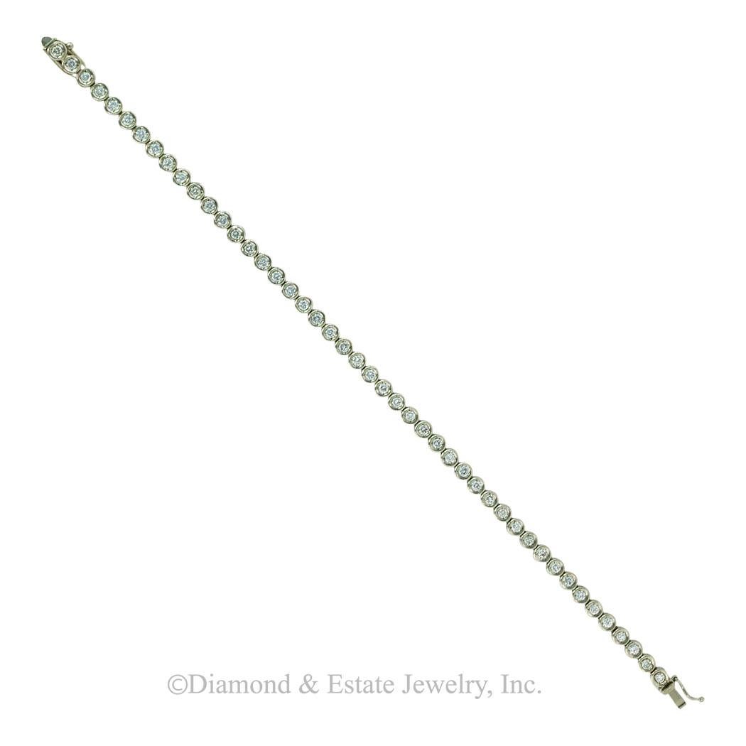 Diamond and platinum line bracelet circa 1990, 8