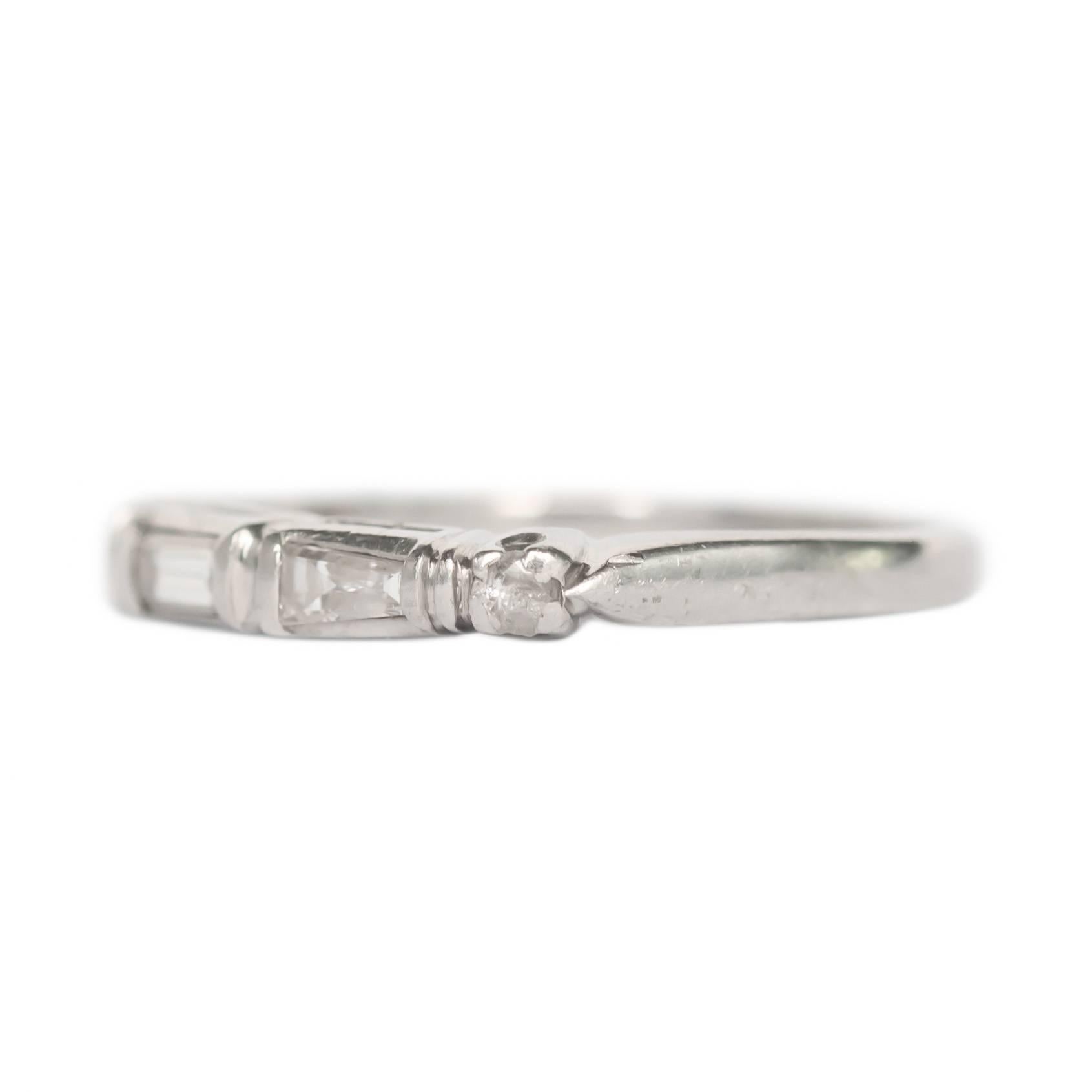 Item Details: 
Ring Size: 6.25
Metal Type: Platinum 
Weight: 2.8 grams

Side Stone Details: 
Shape: Baguette and Round Brilliant 
Total Carat Weight: .25 carat total weight
Color: F
Clarity: VS

Finger to Top of Stone Measurement: 2.74mm