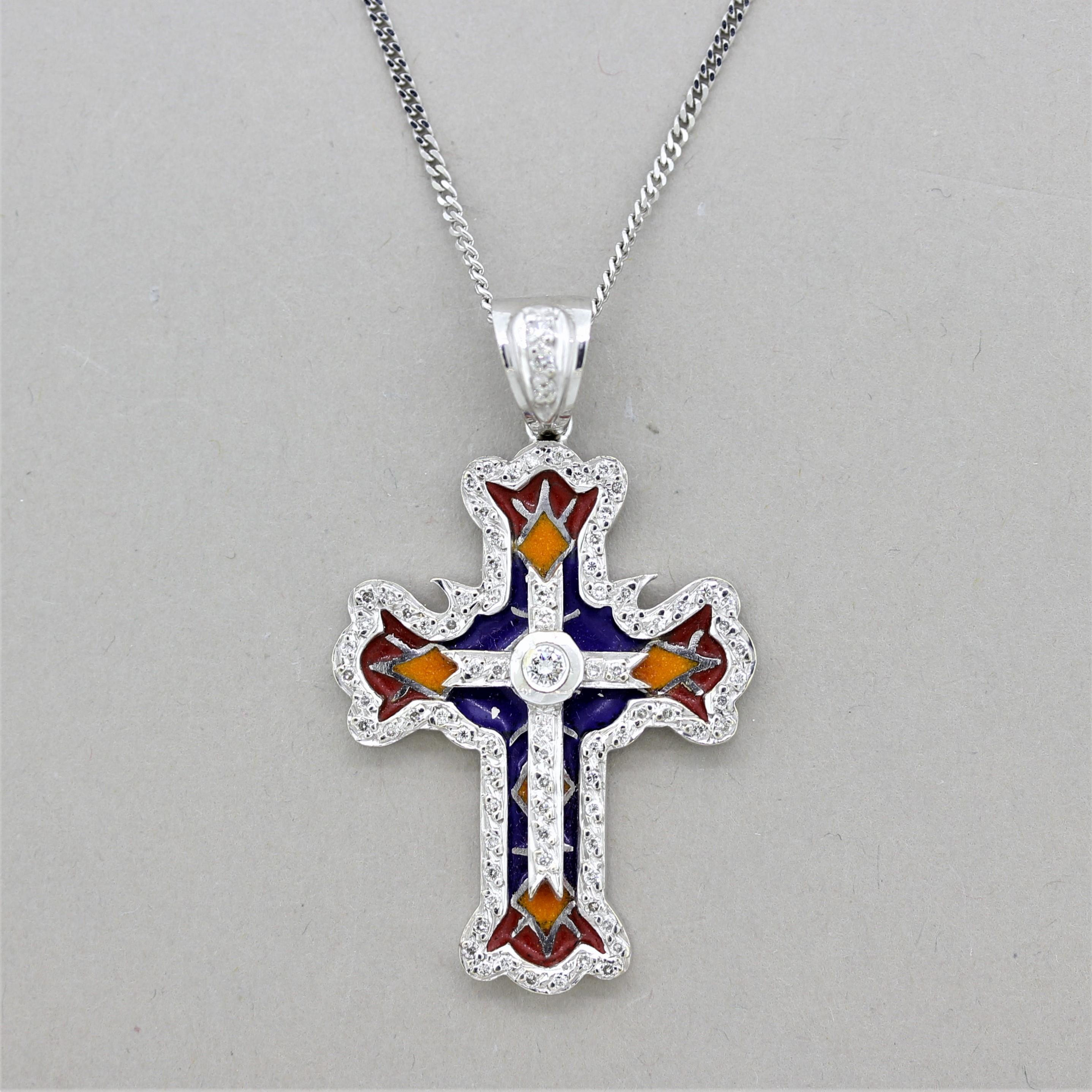 A marvelously unique and beautiful cross pendant featuring 0.56 carats of round brilliant-cut diamonds along with detailed and colorful enamel. The enamel is applied in empty cells instead of over metal which allows light to go through the enamel