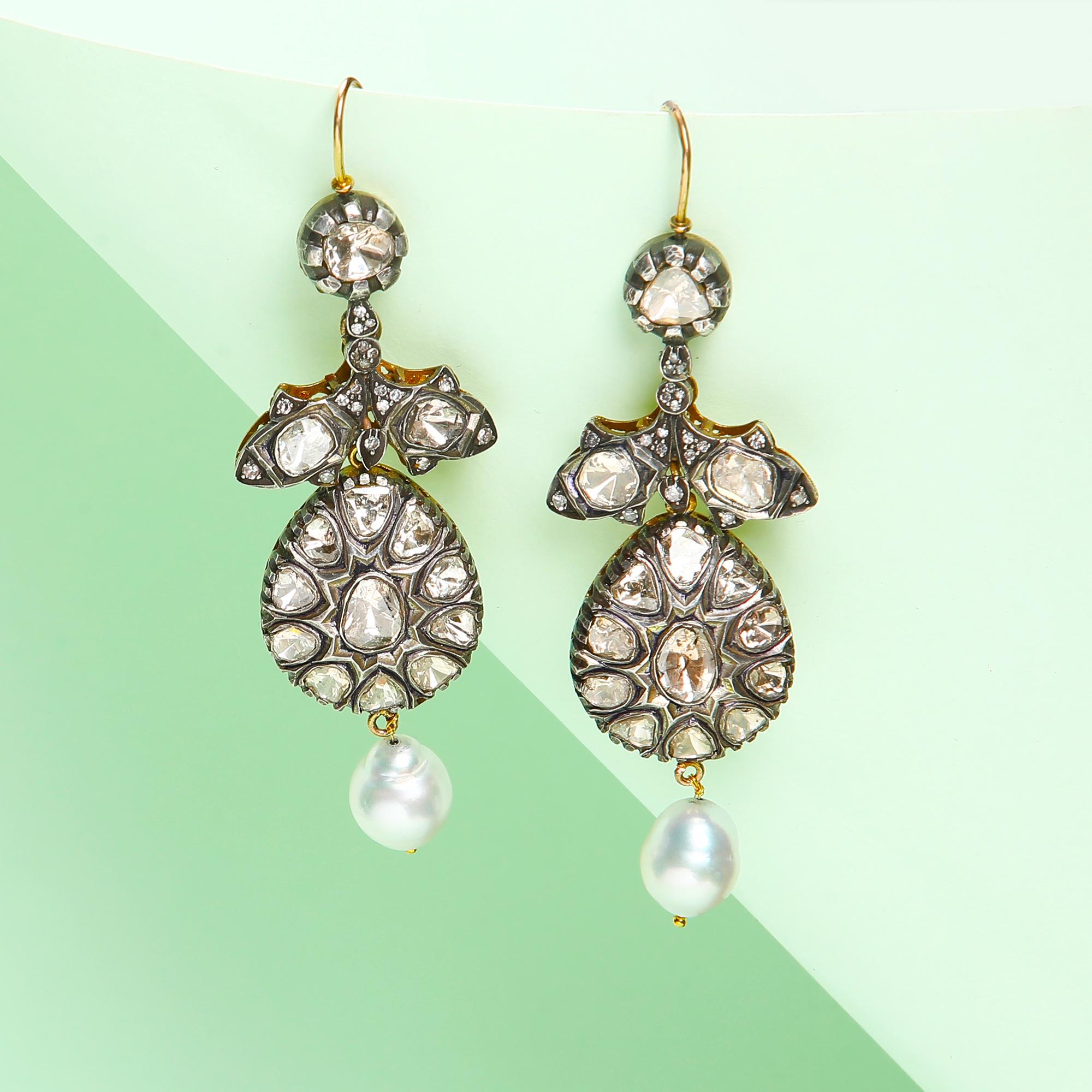 Playful but elegant ear rings. 
Chunky polki and a pearl drop come together in this unique gold and silver piece. Unlike anything else out there!