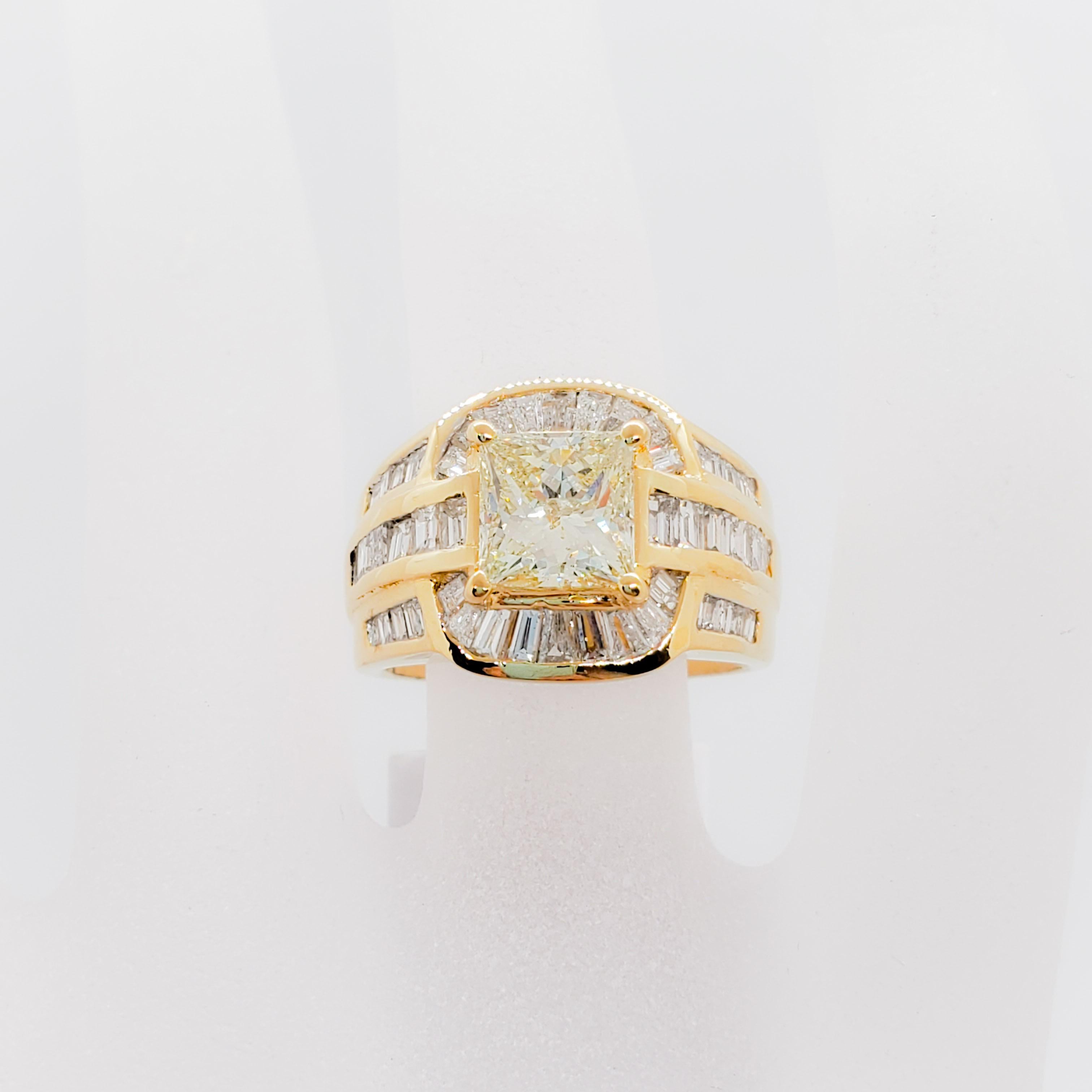 This estate ring features 2.09 ct. of good quality diamond princess cut and 1.88 ct. white diamond baguettes in a beautiful handmade 18k yellow gold setting.  Ring size is 6.25.  Perfect to wear everyday or for a special occasion.  Mint condition.