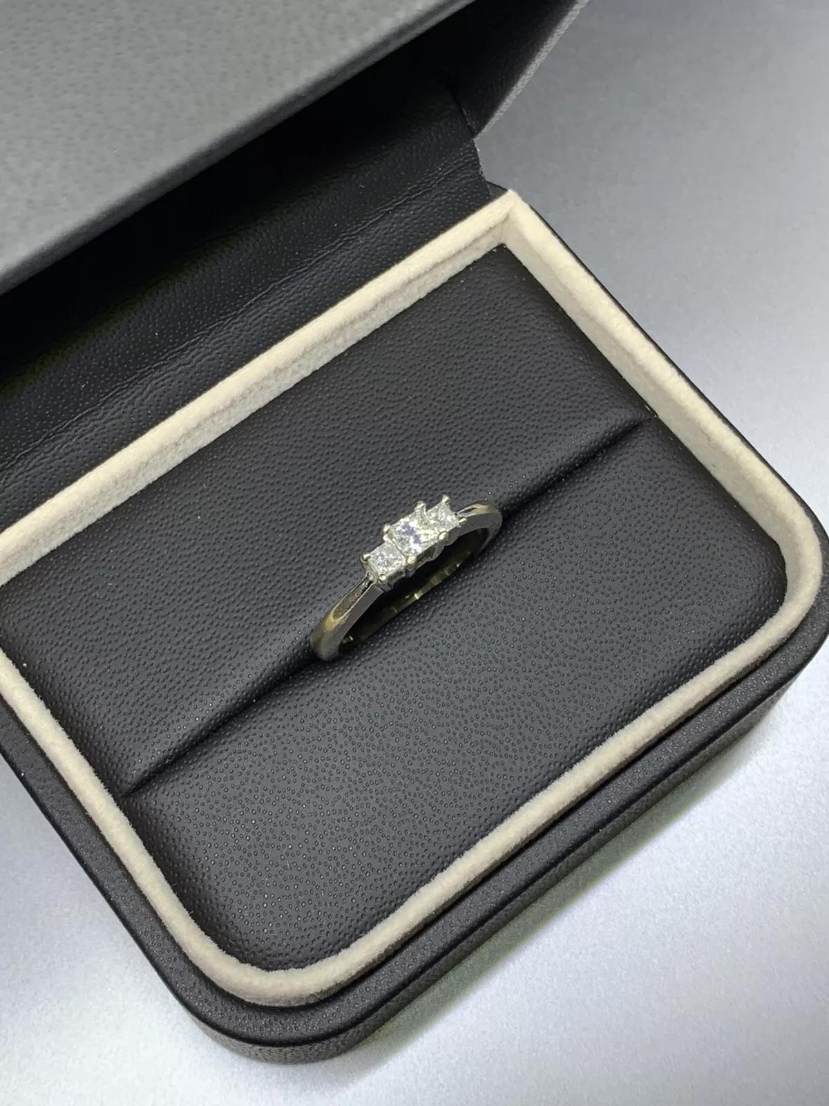 0.60ct Princess diamond trilogy engagement ring in 18k white gold.

Diamonds total weight 0.60ct beautiful matching square cut diamond cushion cut.

Chunky trilogy engagement ring wedding bridal jewellery.

Total diamond weight 0.60ct F colour VS1