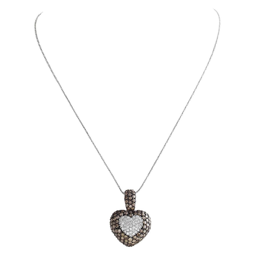 Diamond puff heart necklace 18k, with approximately 2 carats in champagne colored diamonds and 0.75 carats in G-H color, VS clarity white diamonds. 21mm x 28.5mm heart size. Length 16 inches.
