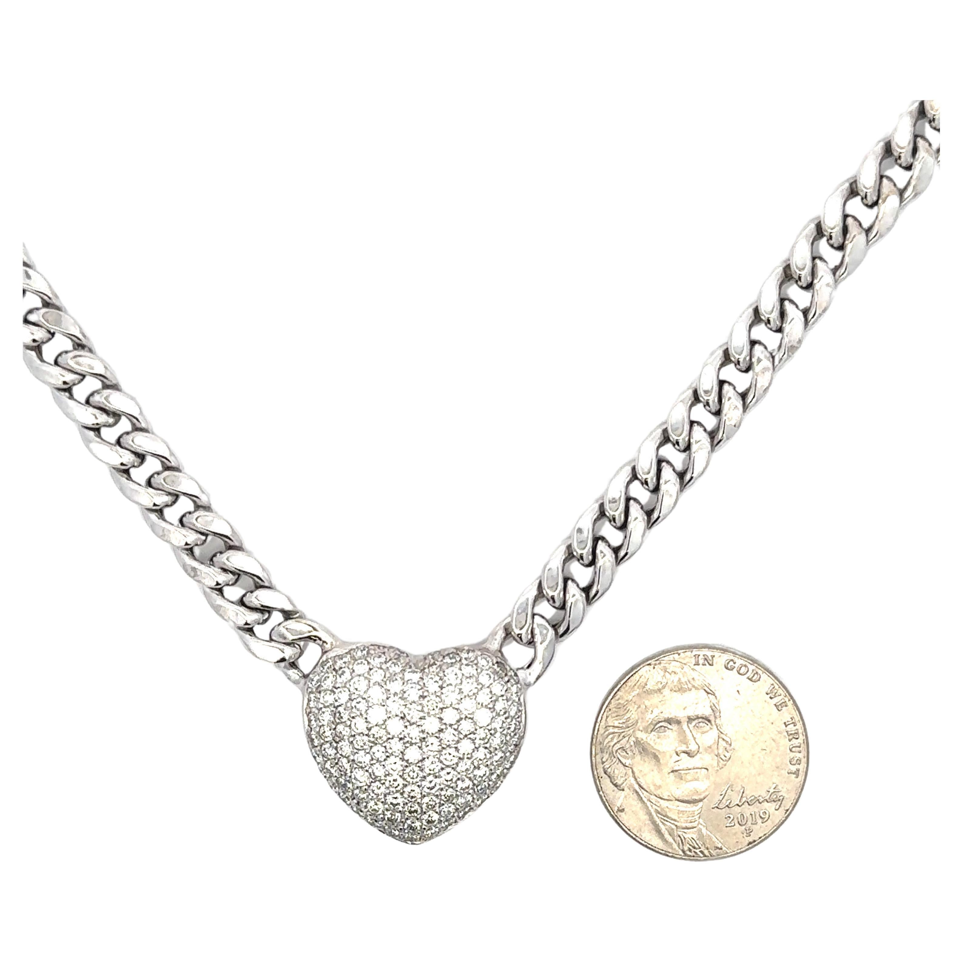 Fashionable puffed heart pendant featuring 118 pave diamonds weighing 2.30 carats on a Cuban link necklace weighing 30.38 grams.
Available in yellow gold. 
