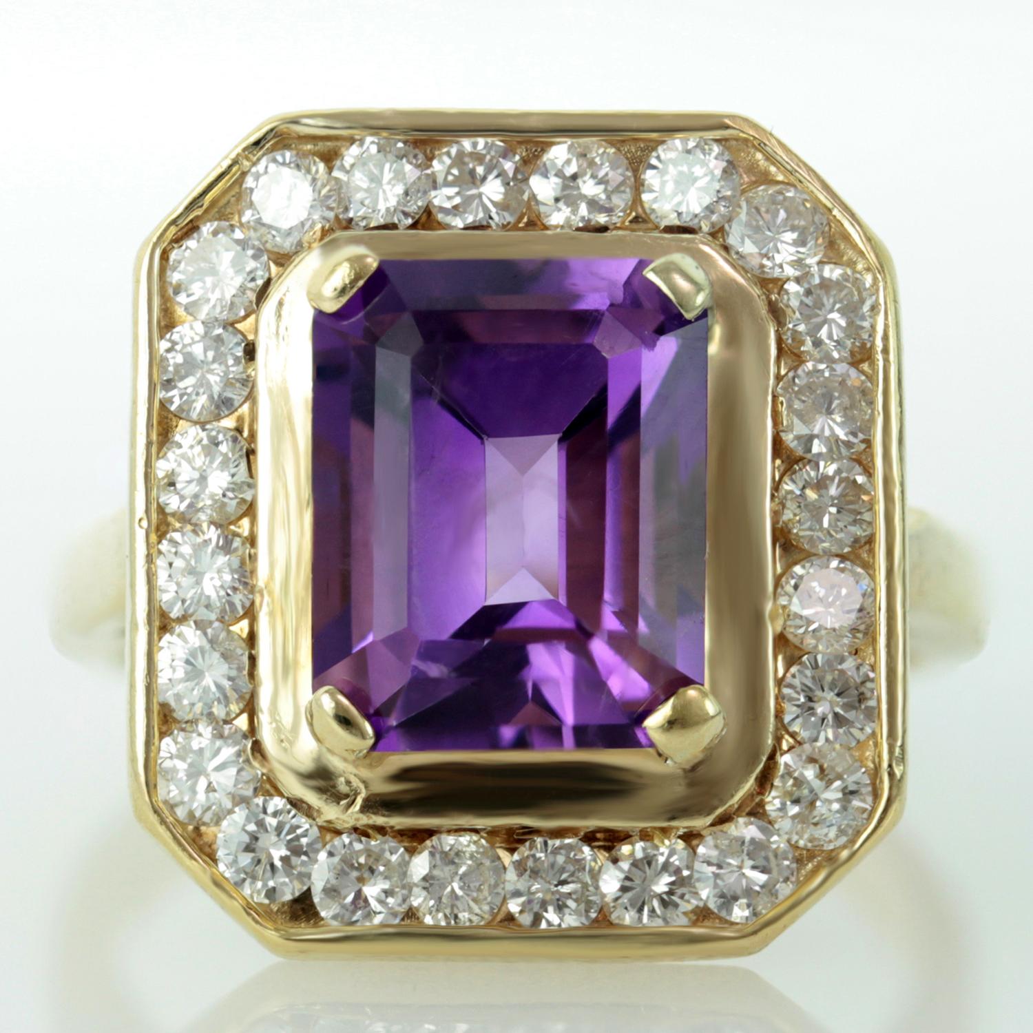 This stunning vintage women's ring is made in 14k yellow gold and set with a faceted 8.0mm x 10.0mm amethyst of an estimated 4.50 carats surrounded by sparkling round H-I VS2-SI1 diamonds of an estimated 1.0 carats. Circa 1960s. Measurements: 0.70