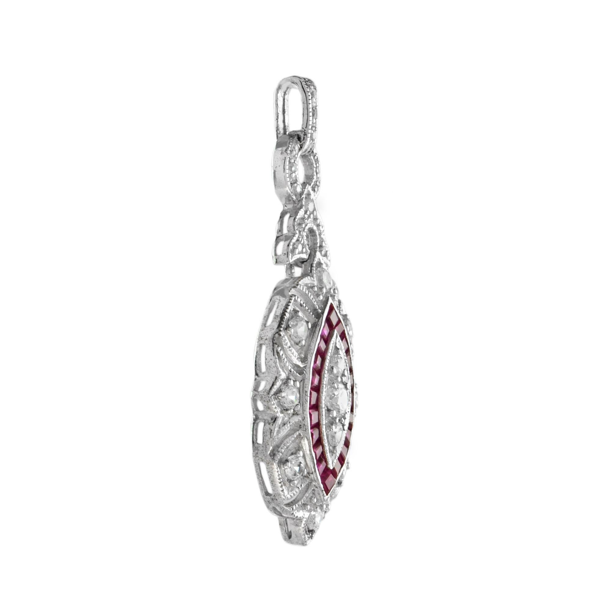 This beautiful Art Deco style pendant is finished in brightly polished. Delicately set across the face of the pendant are three round diamonds surrounded by French cut natural ruby. The entire pendant is adorned with round diamonds. A truly stunning