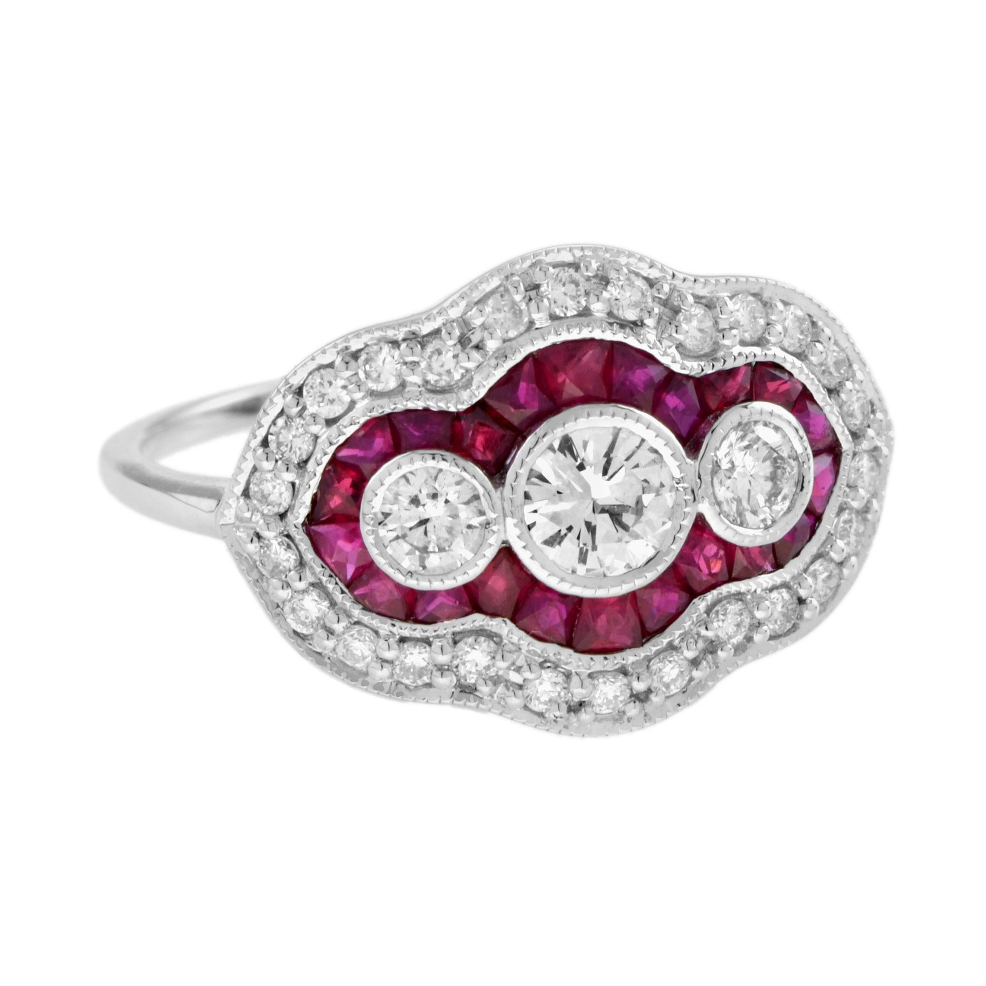 Made entirely of white gold, this stunning Art Deco inspired ring is elegant and timeless. Three round diamonds form the center of the ring’s top, and they’re enveloped by a group of French cut blue sapphires. The rest of the ring is prepared with