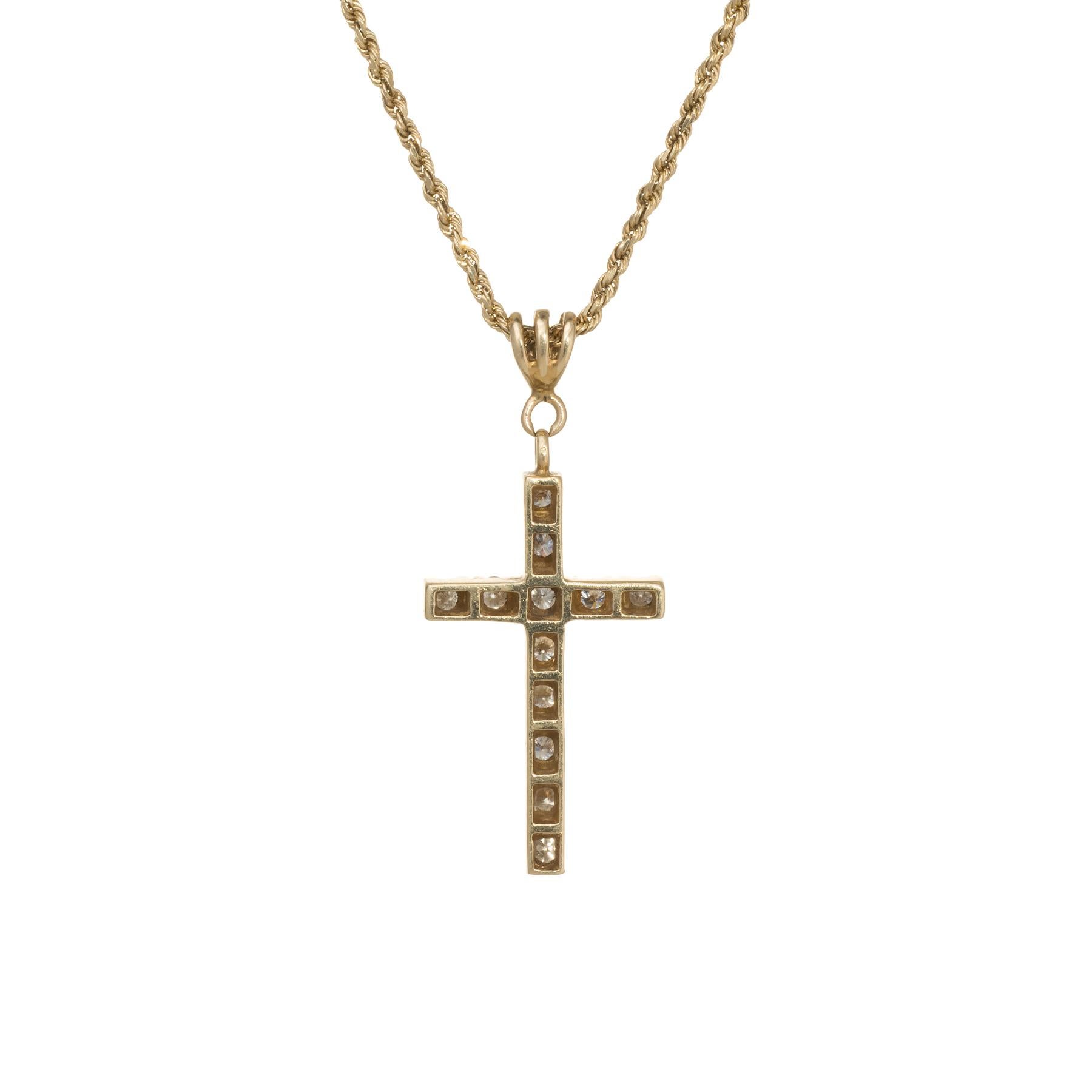 Finely detailed diamond religious cross pendant, crafted in 14 karat yellow gold.  

A total of 12 round brilliant cut diamonds total an estimated 0.48 carats (estimated I-J color and VS2-SI1 clarity).  

The pendant comes with a fine link 14k