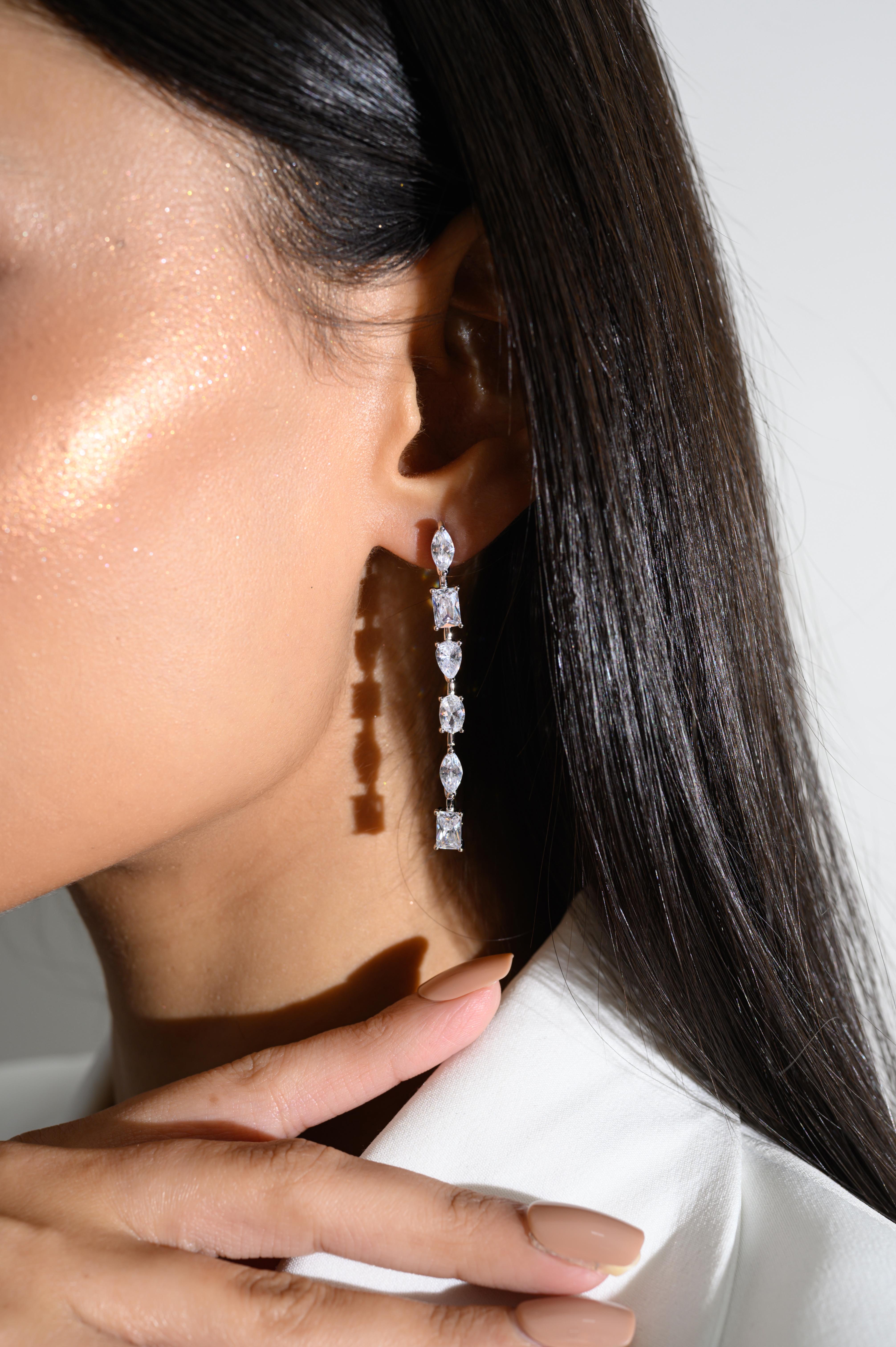 Diamond Rhinestone Linear Dangle Earrings for Her in sterling silver. You shall need these statement dangle earrings to make a statement with your look. Each piece features dazzling cubic zirconia stones, renowned for their brilliance and clarity,